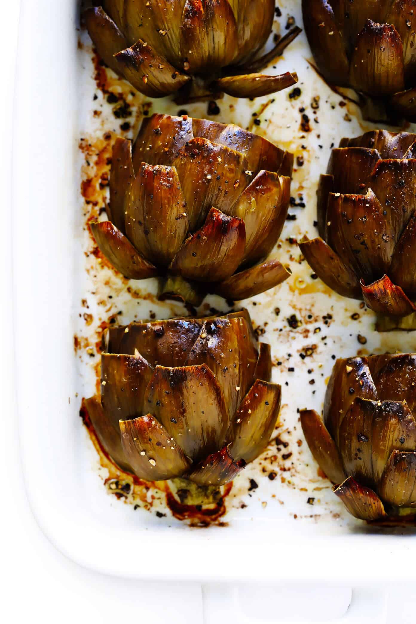 The most amazing Roasted Artichokes recipe! They’re easy to make, full of big and fresh flavors, and always a crowd fave! | Gimme Some Oven #artichokes #roasted #healthy #vegetarian #vegan #glutenfree #dinner #thanksgiving Roasted Artichokes Recipe