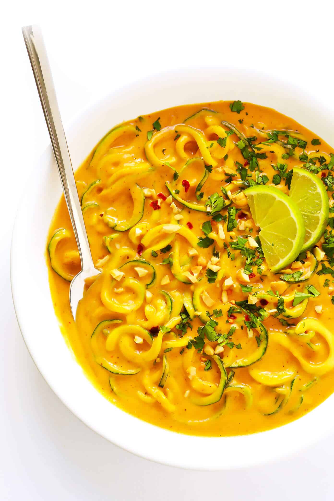 Love these Curried Satay Veggie Bowls! They only take about 20 minutes to make, they're made with lots of zoodles (or you can sub in other veggies or rice noodles), and feature the most heavenly red curry sauce (featuring chickpeas, coconut milk and peanut butter, YUM). Perfect for an easy dinner or meal prep! | Gimme Some Oven #glutenfree #vegan #curry #dinner #healthy #vegetarian Curried Satay Veggie Bowls with Zoodles