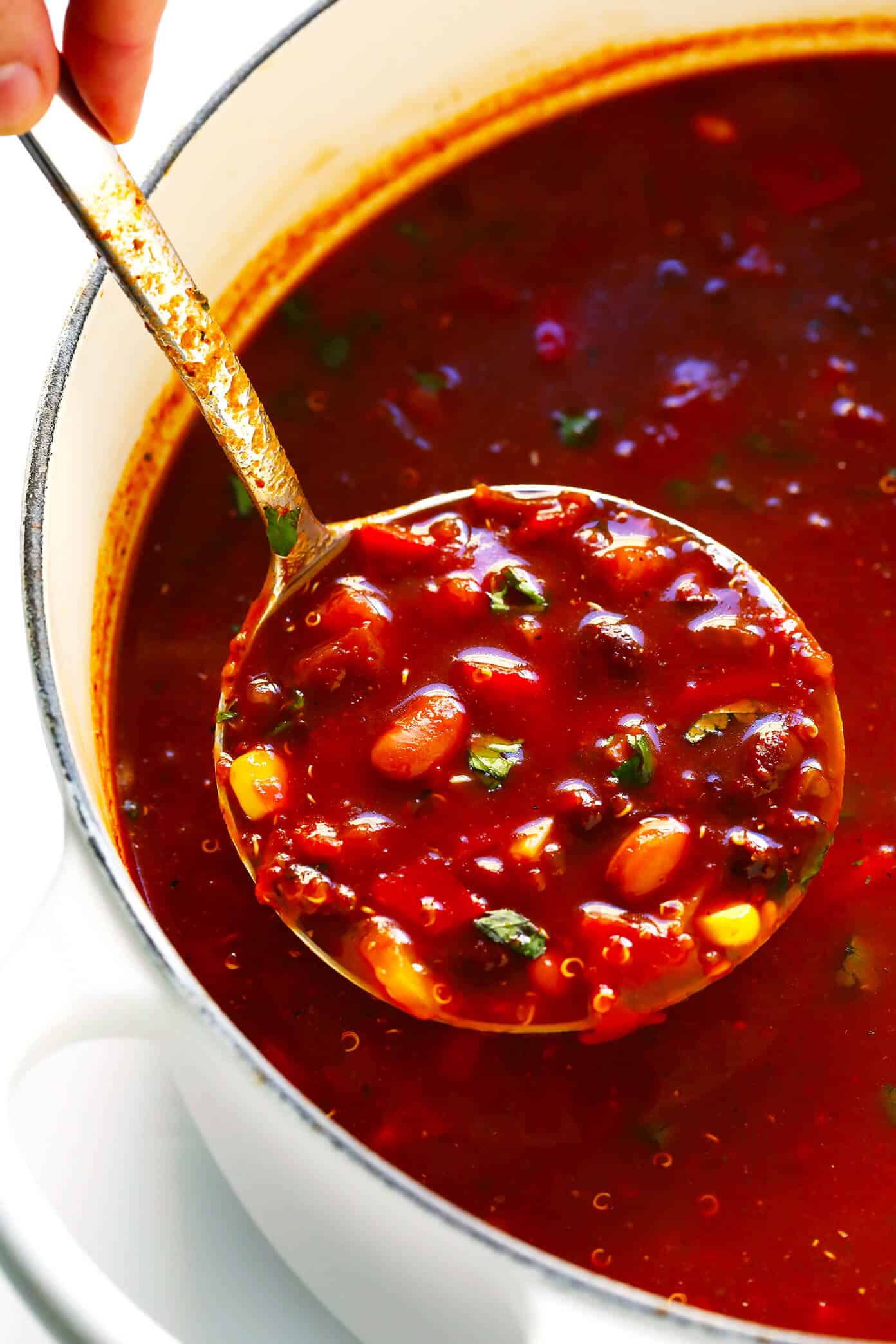 LOVE this Quinoa Tortilla Soup! It's naturally vegetarian, vegan and gluten-free. It's full of big flavors, made with the most delicious chile tomato broth, and best when piled high with lots of avocado and toppings. And it is totally hearty, comforting and delicious. Easy Mexican dinner for the win! | Gimme Some Oven #tortillasoup #mexican #glutenfree #vegan #vegetarian #soup Vegetarian Quinoa Tortilla Soup