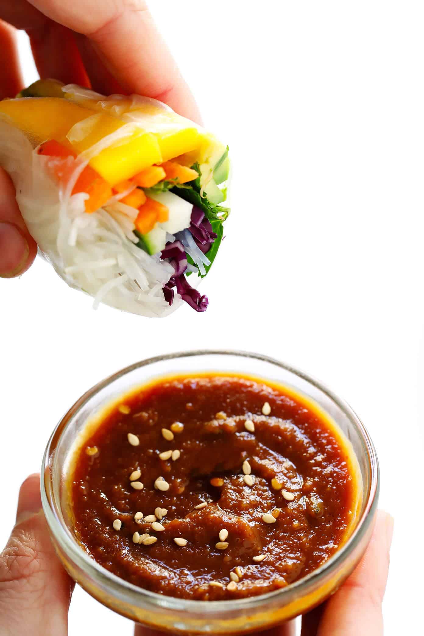 Love these Mango Avocado Spring Rolls! They're easy to make with your favorite fillings, naturally gluten-free and vegan, and served with the most irresistible peanut dipping sauce. The perfect appetizer, snack or main course! | Gimme Some Oven #springrolls #appetizer #glutenfree #vegetarian #peanutsauce Easy Mango Avocado Spring Rolls dipped in a delicious peanut sauce