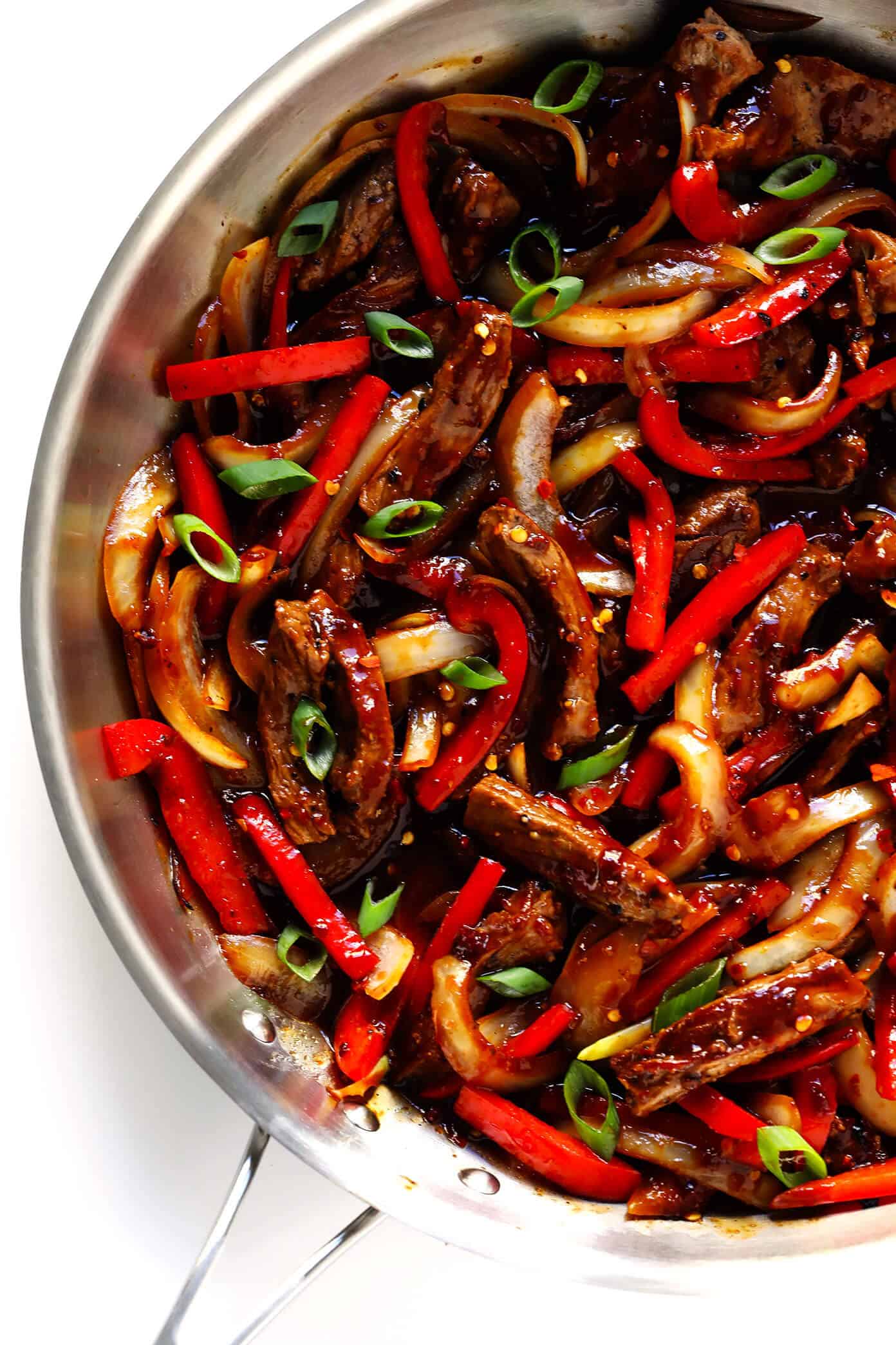 Love this Sizzlin' Spicy Szechuan Stir-Fry! It only takes about 20 minutes to make, it's easy to customize with beef, chicken, pork, shrimp or tofu, and it's made with the most delicious Szechuan sauce! | Gimme Some Oven #szechuan #chinese #stirfry #dinner #spicy Sizzlin' Spicy Szechuan Stir-Fry