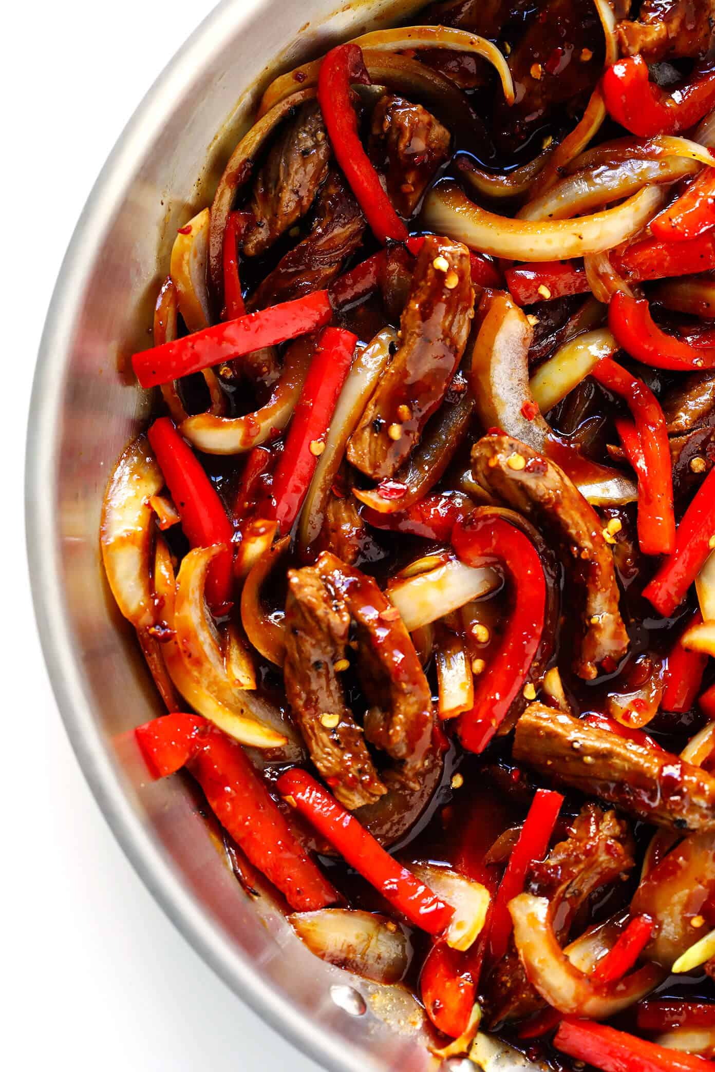 Love this Sizzlin' Spicy Szechuan Stir-Fry! It only takes about 20 minutes to make, it's easy to customize with beef, chicken, pork, shrimp or tofu, and it's made with the most delicious Szechuan sauce! | Gimme Some Oven #szechuan #chinese #stirfry #dinner #spicy Spicy Steak Stir-Fry with Szechuan Sauce