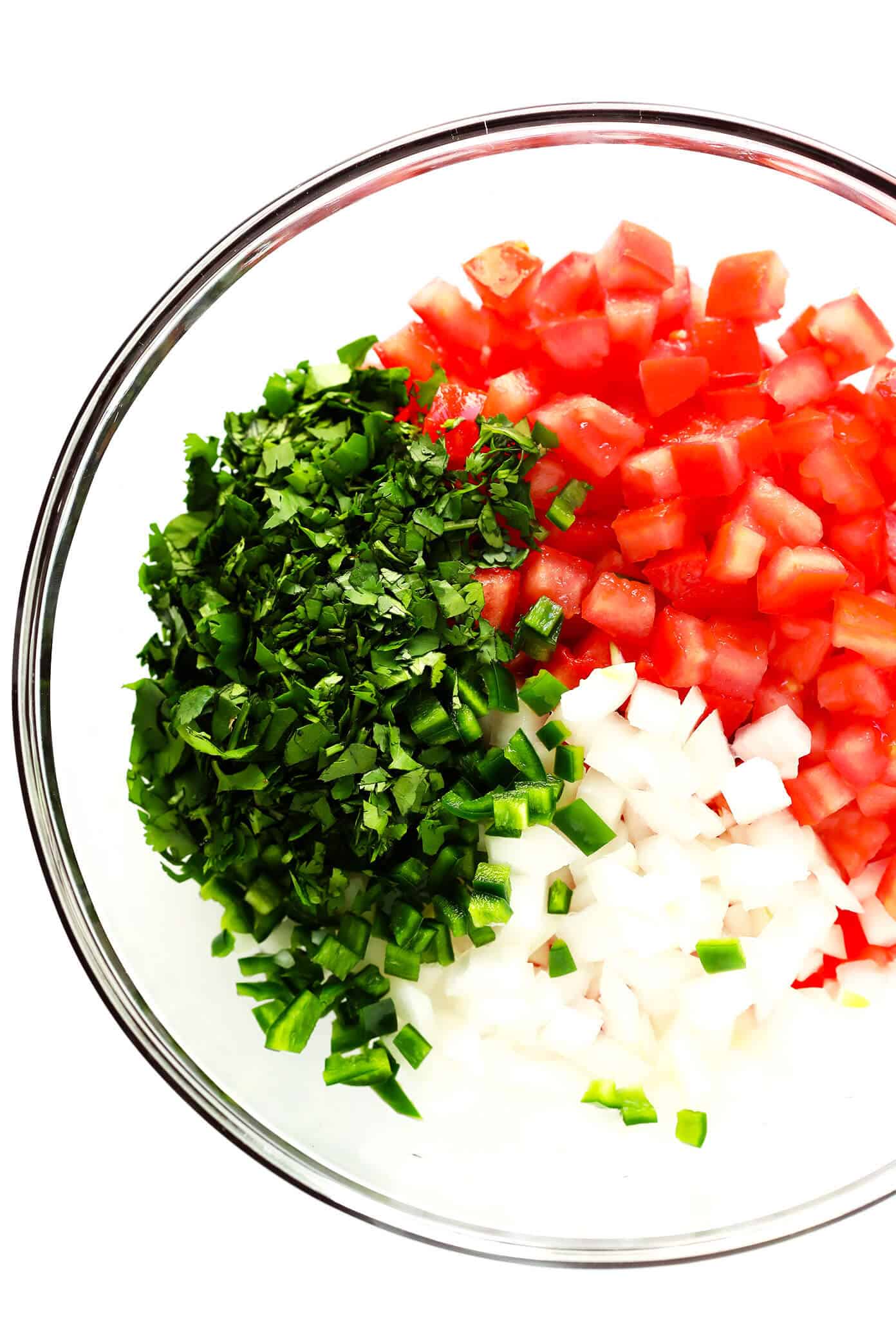The BEST Pico de Gallo recipe! It's easy to make in 10 minutes with just 7 ingredients, it's perfect for topping all of your favorite Mexican dishes, or eating simply as salsa with chips. It's also naturally gluten-free and vegan, and perfect for Cinco de Mayo. | Gimme Some Oven #picodegallo #mexican #salsa #glutenfree #appetizer #vegan Pico de Gallo Ingredients