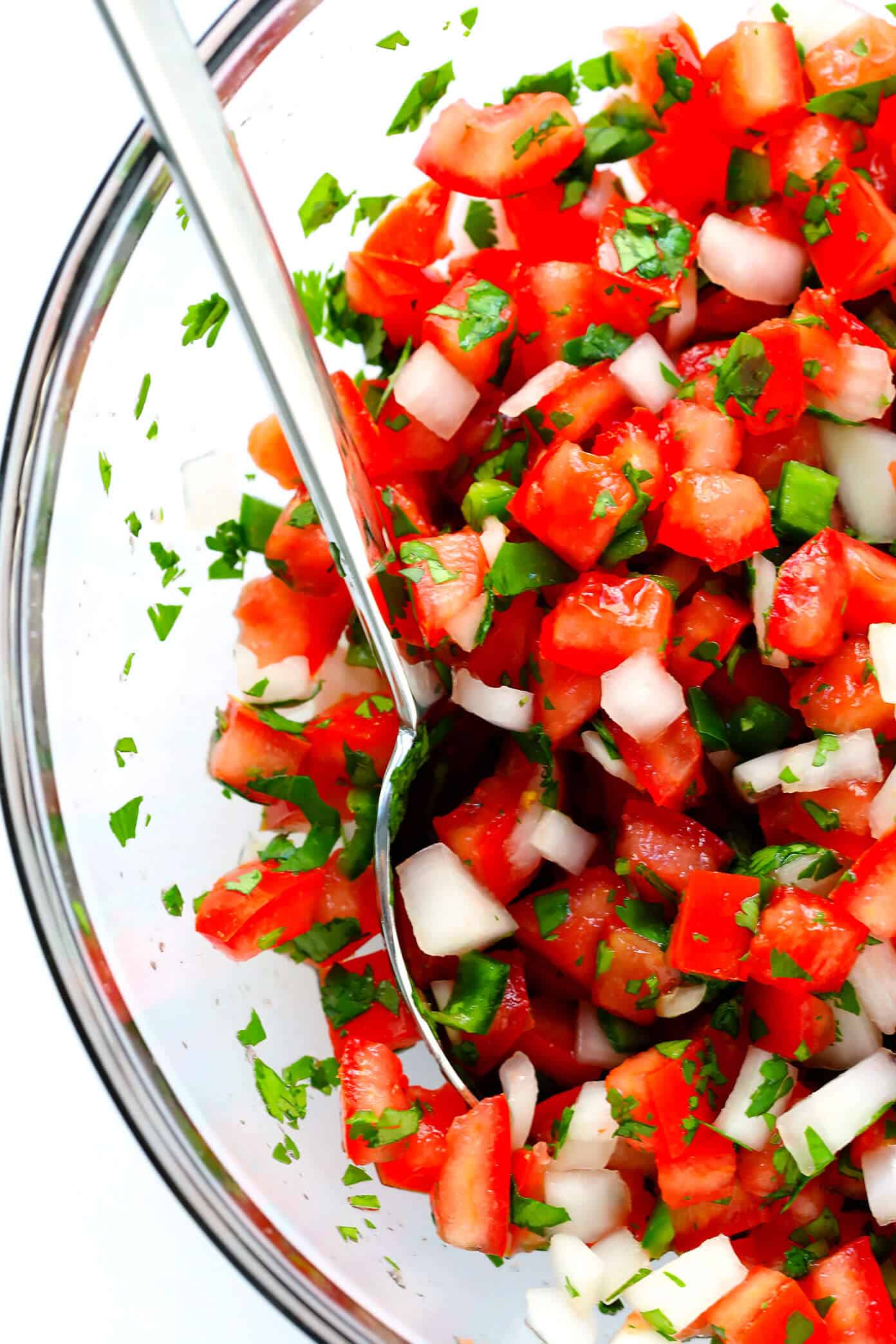 The BEST Pico de Gallo recipe! It's easy to make in 10 minutes with just 7 ingredients, it's perfect for topping all of your favorite Mexican dishes, or eating simply as salsa with chips. It's also naturally gluten-free and vegan, and perfect for Cinco de Mayo. | Gimme Some Oven #picodegallo #mexican #salsa #glutenfree #appetizer #vegan Mexican Pico De Gallo Recipe