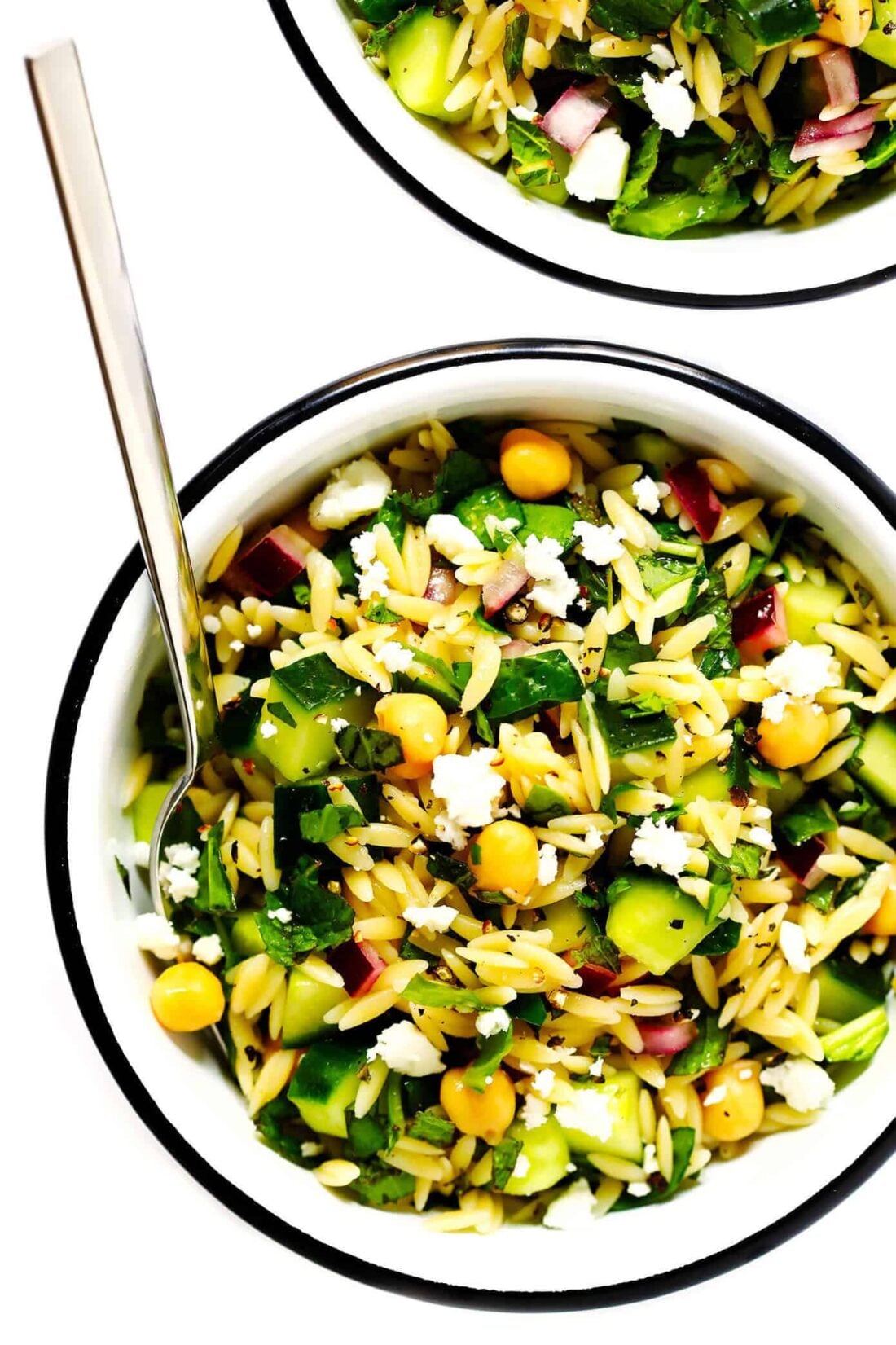 This Lemony Orzo Pasta Salad is made with hearty orzo pasta, fresh spinach or arugula, chickpeas, cucumber, onions, feta cheese, and a lemon herb dressing. It's the perfect make ahead pasta salad for summer! | gimmesomeoven.com #pastasalad #vegetarian #dinner #mealprep #dressing #pasta Lemon Orzo Chickpea Pasta Salad Recipe
