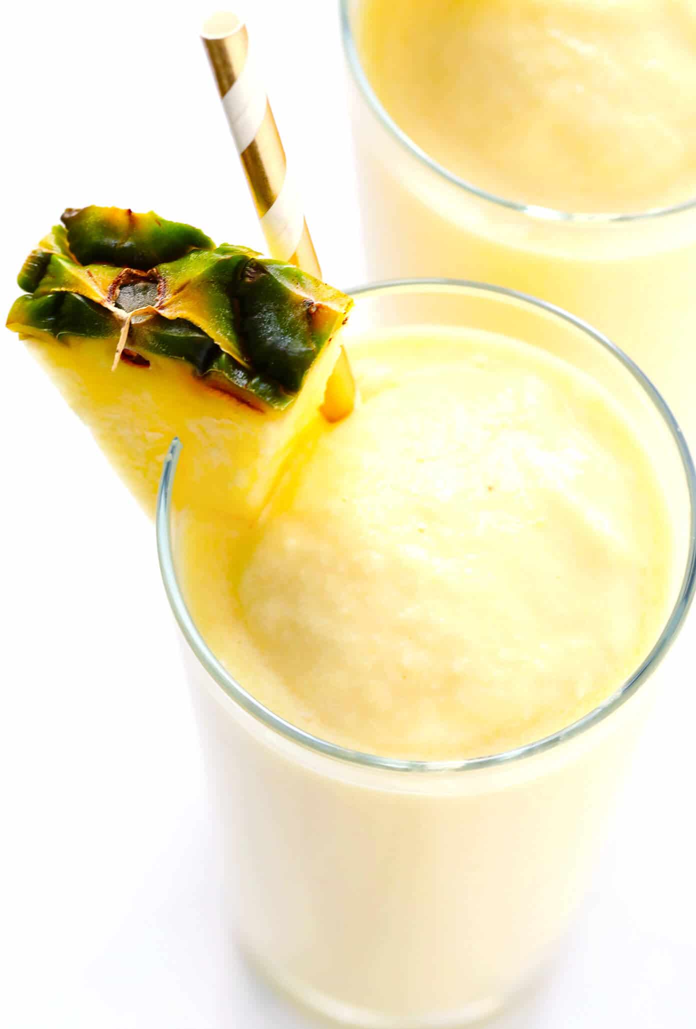 The BEST Piña Colada recipe -- made with three easy ingredients, no added sweeteners, and SO delicious. Pineapple and coconut make for the perfect frozen summer cocktail! | Gimme Some Oven #pinacolada #pineapple #cocktail #frozen #drink #summer #rum Easy Piña Colada Recipe...made with just 3 ingredients!