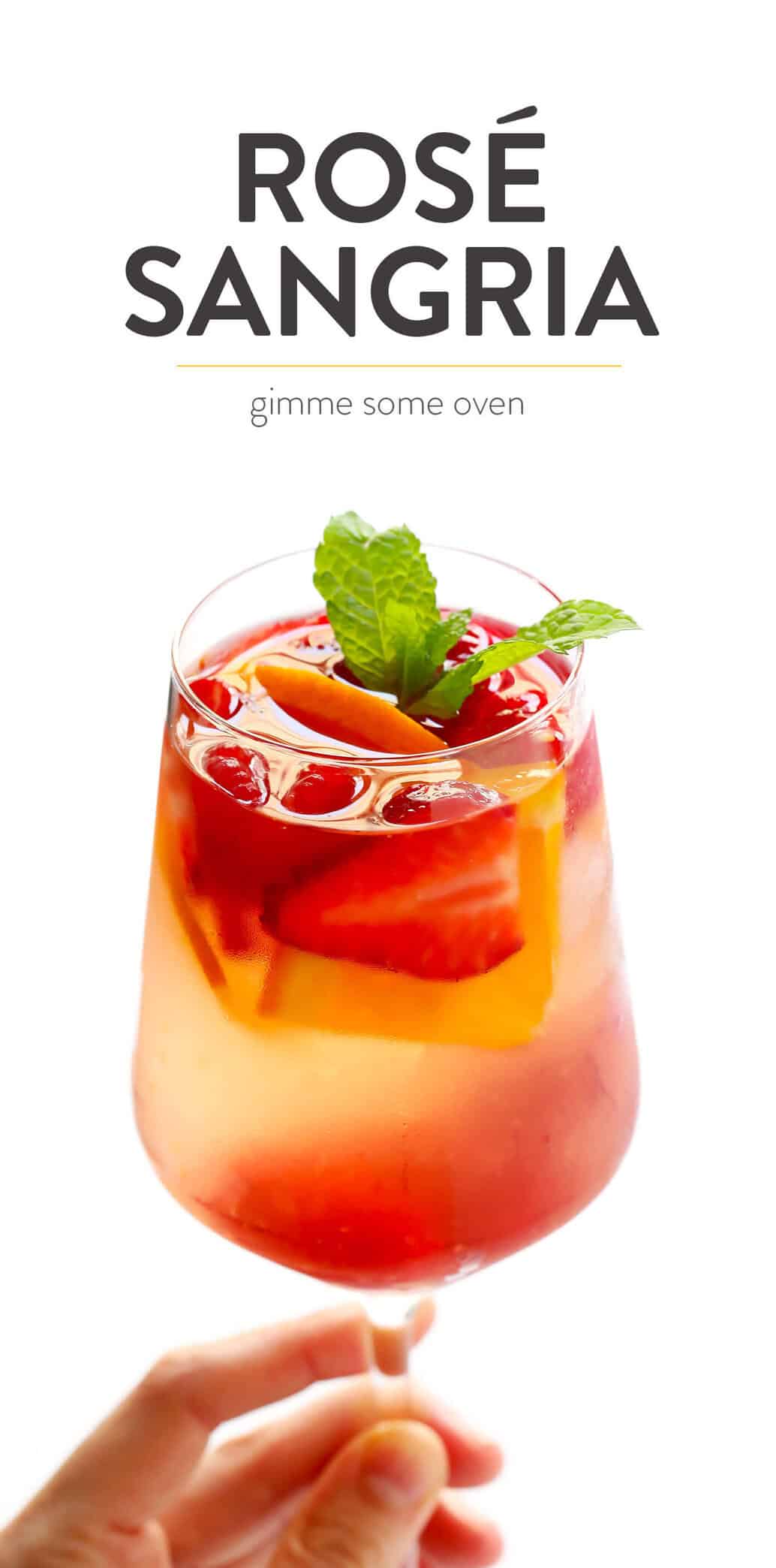 This lovely Rosy Rosé Sangria recipe is made with crisp rosé wine, your choice of fresh fruit (strawberry, raspberry, peach, etc.), and finished off with a subtle floral hint of rose water. It's perfect for brunch, happy hour, or summer dinner parties, and so refreshing and delicious! | Gimme Some Oven #sangria #rose #wine #summer #cocktail How To Make Rosé Sangria Recipe