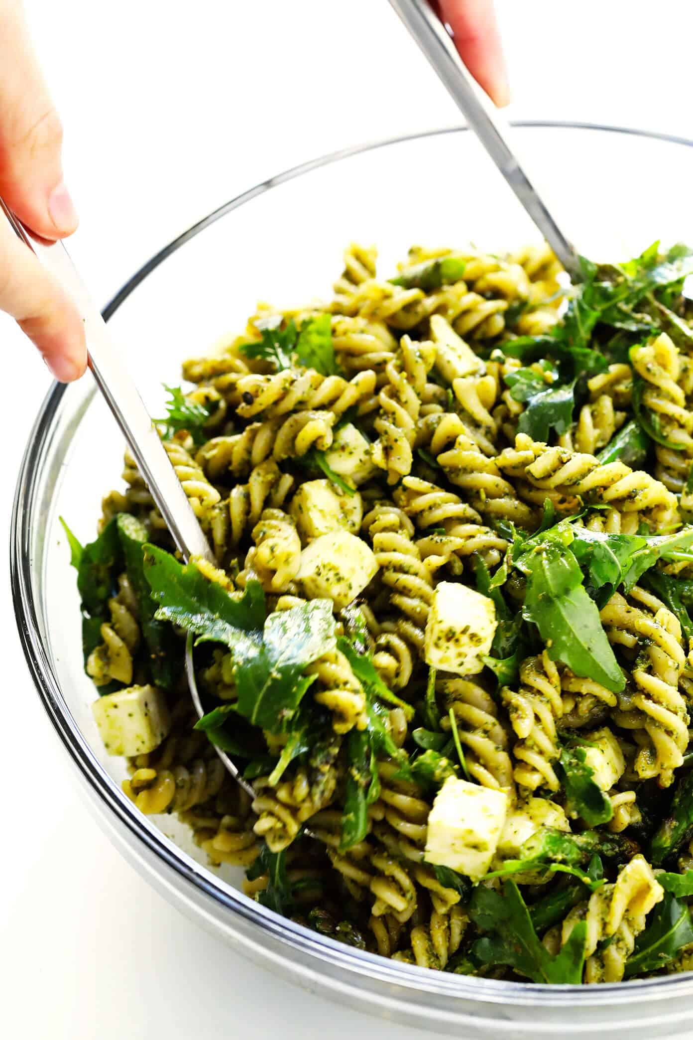 This Pistachio Pesto Pasta Salad recipe is made with asparagus (or your choice of veggie), arugula, mozzarella, and the most delicious pistachio basil pesto. The perfect make-ahead recipe for summer dinner! | Gimme Some Oven #pastasalad #pesto #summer #dinner #recipe #potluck How To Make Pistachio Pesto Pasta Salad