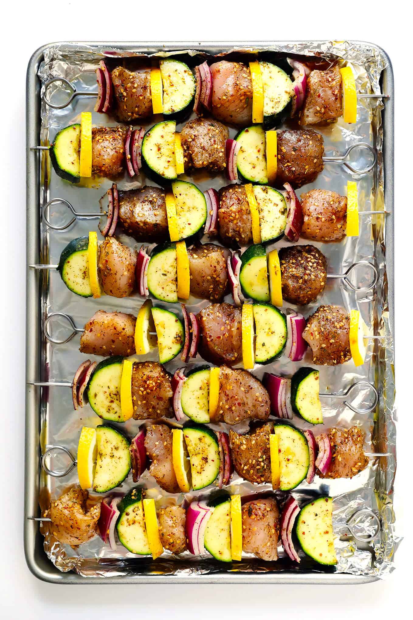 This easy Za'atar Chicken and Vegetable Kabobs recipe is easy to make with your favorite kind of veggies, and tossed with the most delicious lemon za'atar seasoning. Perfect for the grill or roasting in the oven, and naturally gluten-free. | Gimme Some Oven #zaatar #chicken #kabobs #skewers #vegetables Roasted Za'atar Chicken and Veggie Kabobs