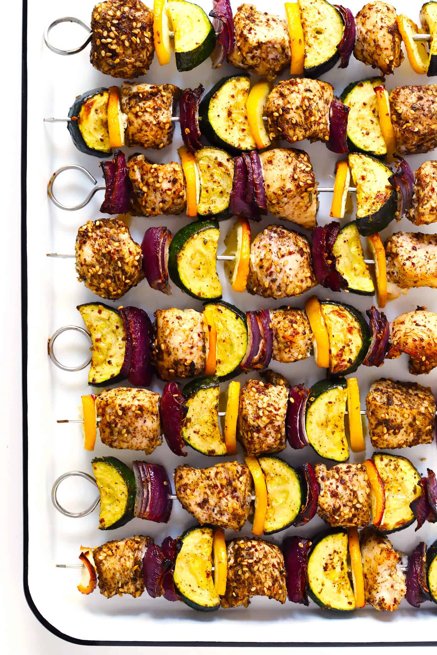 This easy Za'atar Chicken and Vegetable Kabobs recipe is easy to make with your favorite kind of veggies, and tossed with the most delicious lemon za'atar seasoning. Perfect for the grill or roasting in the oven, and naturally gluten-free. | Gimme Some Oven #zaatar #chicken #kabobs #skewers #vegetables Za'atar Chicken and Vegetable Kabobs Recipe