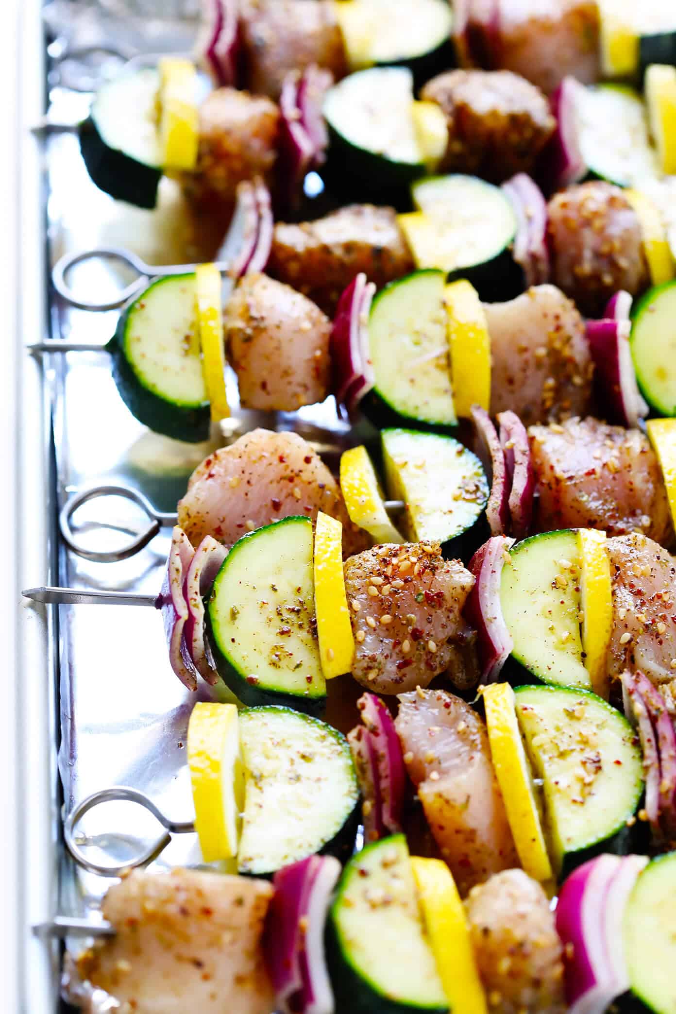 This easy Za'atar Chicken and Vegetable Kabobs recipe is easy to make with your favorite kind of veggies, and tossed with the most delicious lemon za'atar seasoning. Perfect for the grill or roasting in the oven, and naturally gluten-free. | Gimme Some Oven #zaatar #chicken #kabobs #skewers #vegetables Lemony Za'atar Chicken and Vegetable Kabobs