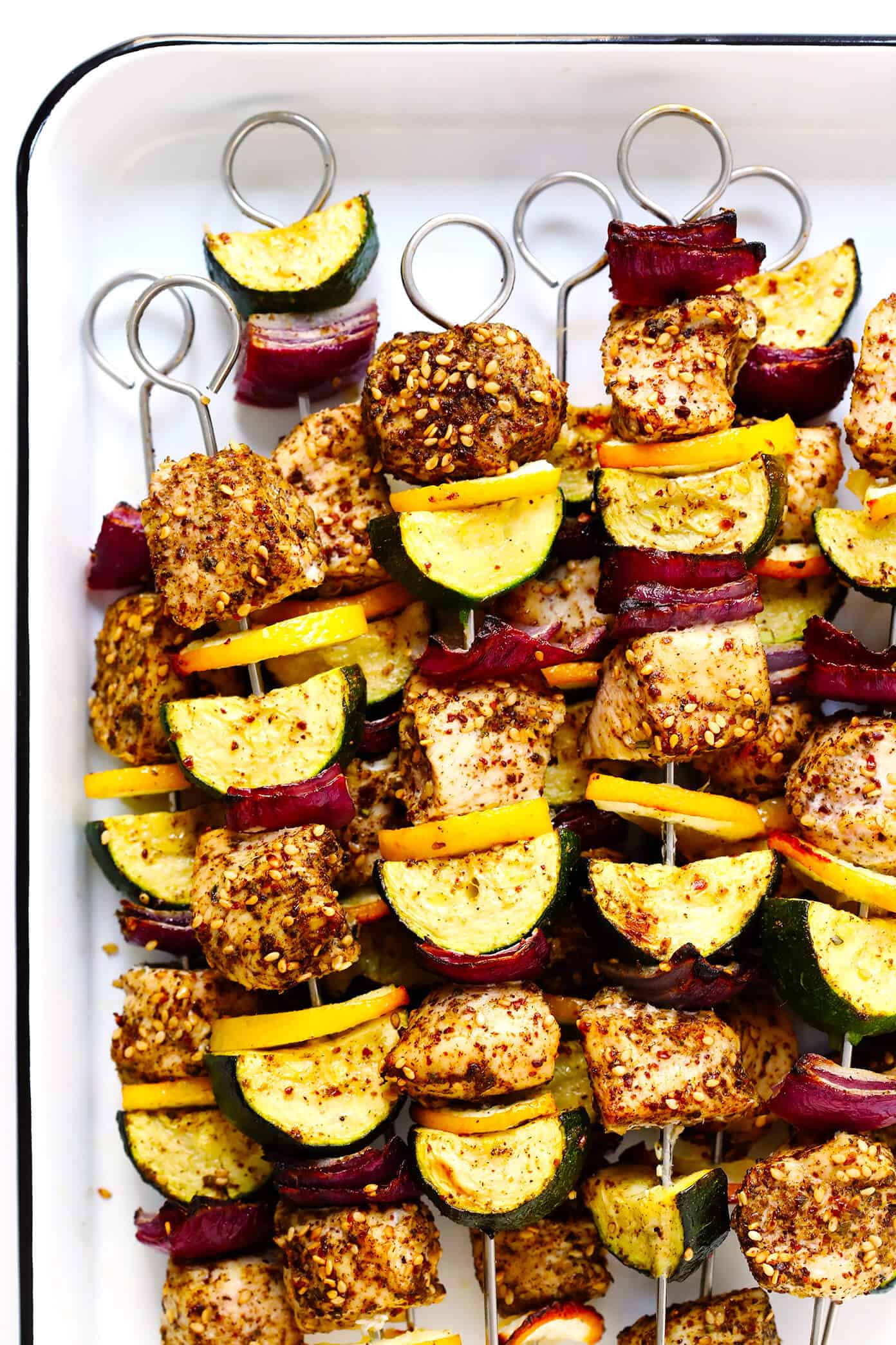This easy Za'atar Chicken and Vegetable Kabobs recipe is easy to make with your favorite kind of veggies, and tossed with the most delicious lemon za'atar seasoning. Perfect for the grill or roasting in the oven, and naturally gluten-free. | Gimme Some Oven #zaatar #chicken #kabobs #skewers #vegetables Za'atar Chicken and Vegetable Kabobs Recipe