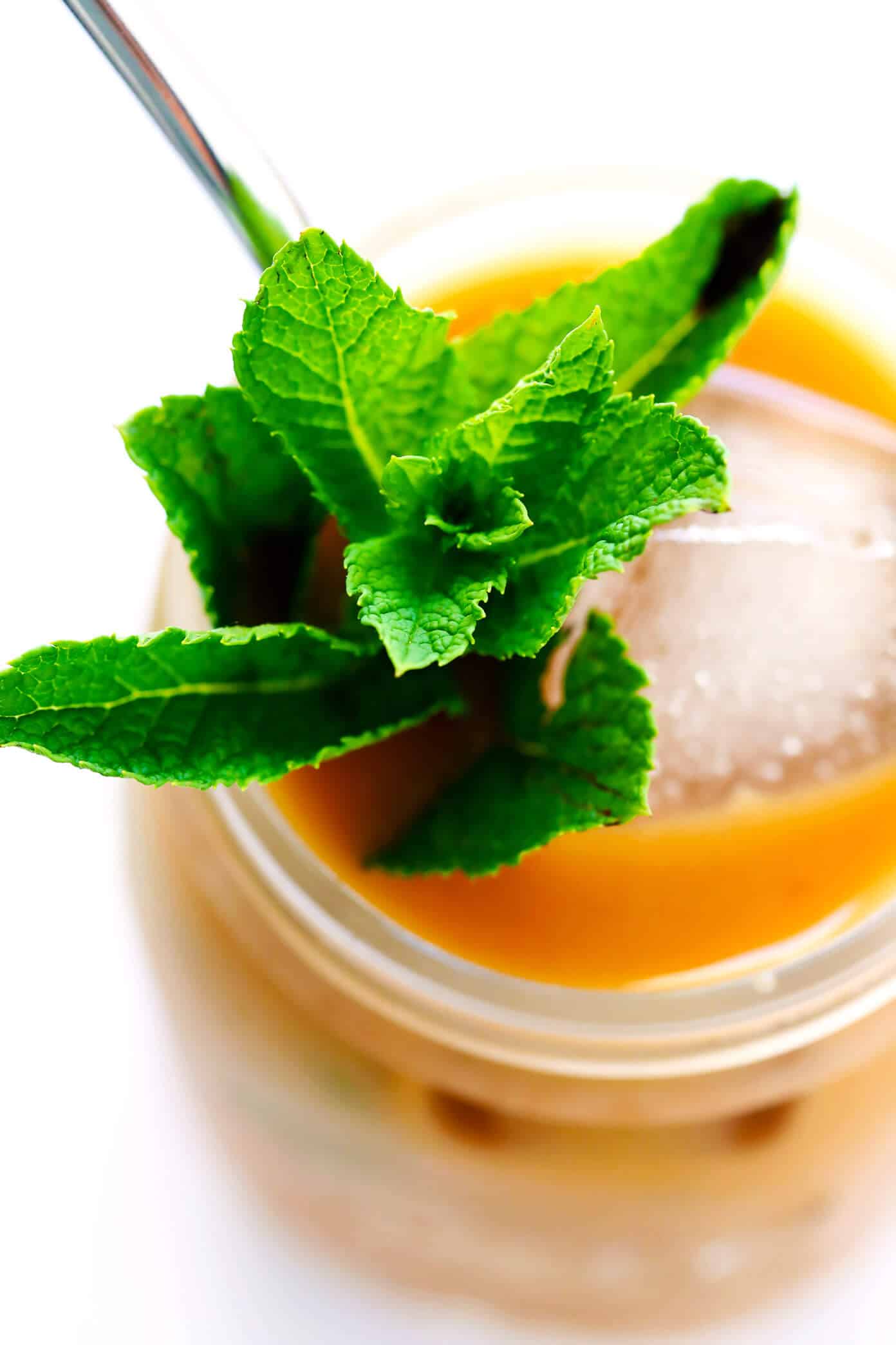 This Mint Mojito Iced Coffee is a TOTAL game-changer. It's easy to make with regular brewed filter coffee, lots of fresh milk, a hint of cream (or coconut milk), your choice of sweetener...and it tastes unbelievably refreshing and delicious! It's the perfect summer drink! | Gimme Some Oven #coffee #icedcoffee #drink #mint The Best Mint Mojito Iced Coffee