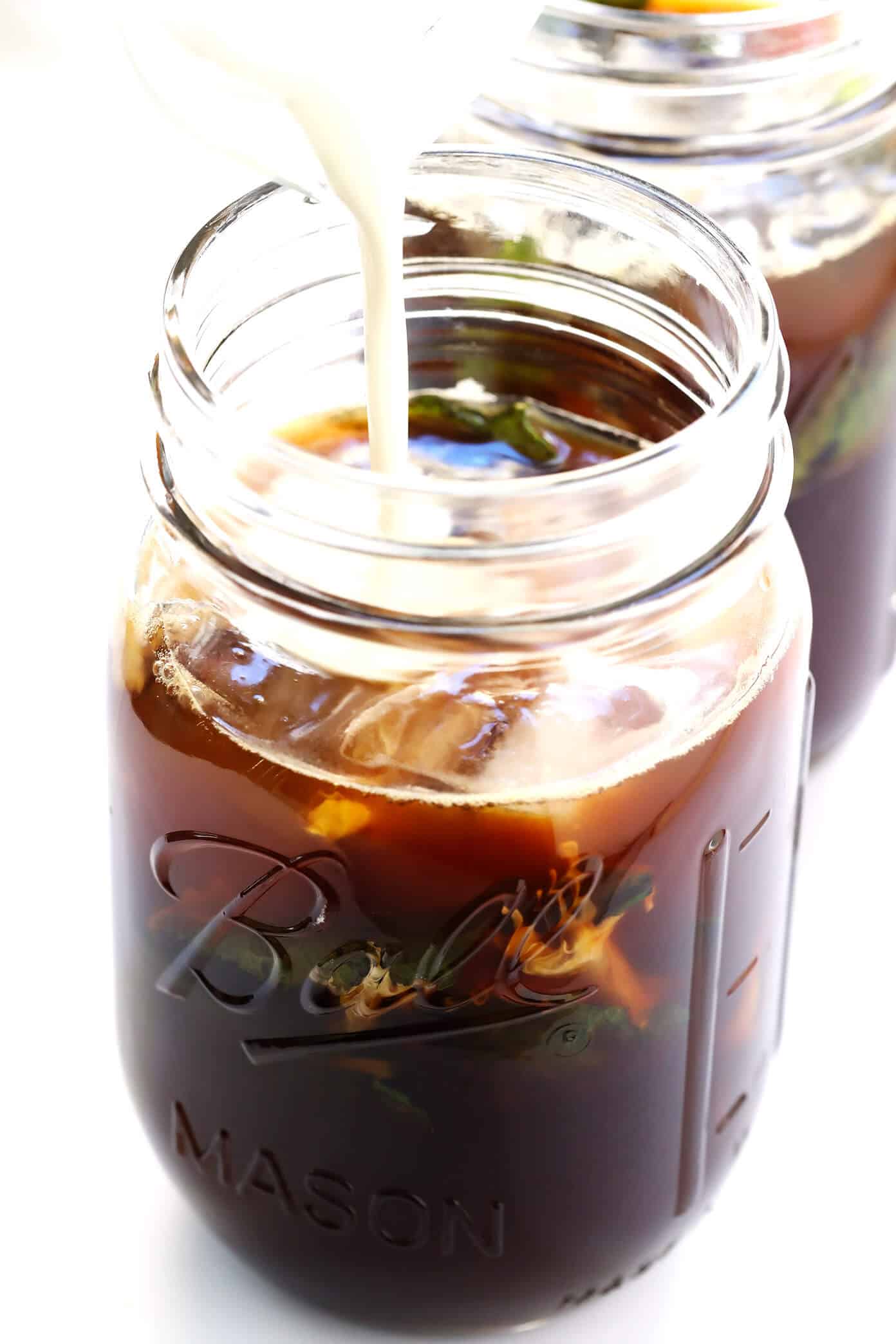 This Mint Mojito Iced Coffee is a TOTAL game-changer. It's easy to make with regular brewed filter coffee, lots of fresh milk, a hint of cream (or coconut milk), your choice of sweetener...and it tastes unbelievably refreshing and delicious! It's the perfect summer drink! | Gimme Some Oven #coffee #icedcoffee #drink #mint Mint Mojito Iced Coffee Ingredients