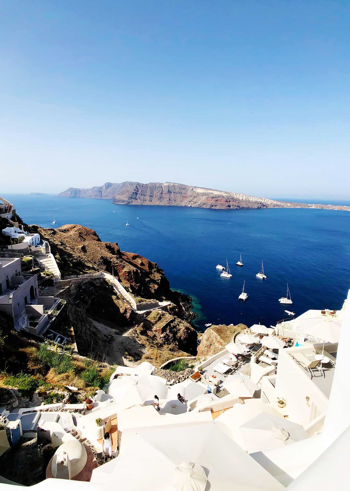 The Gimme Some Oven travel guide for restaurants to eat, hotels to stay and places to visit in Santorini, Greece. | Gimme Some Oven #santorini #greece #travel #traveltips #europe #vacation #islands #hotel #restaurant Ammoudi Bay in Oia Santorini Greece