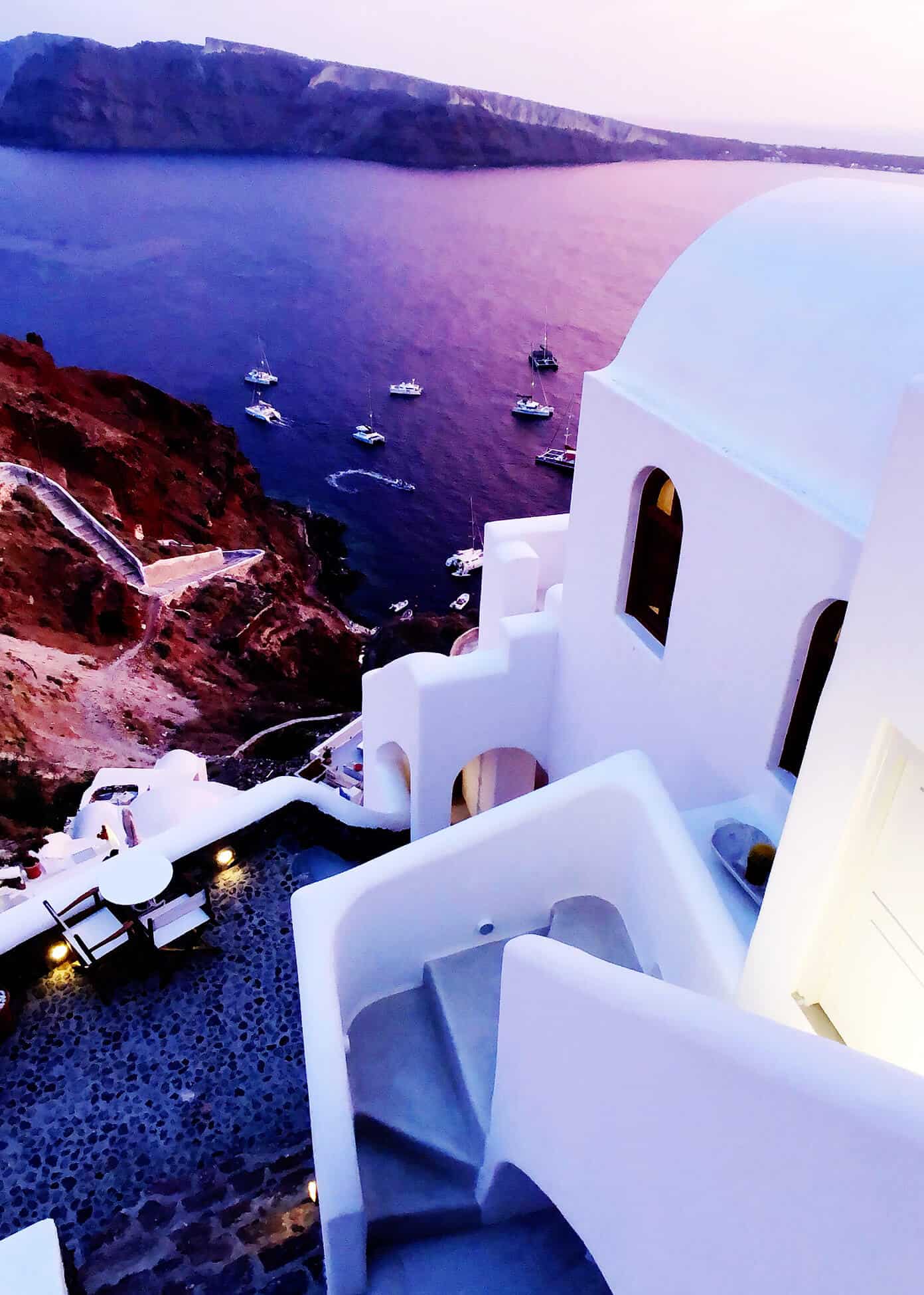 The Gimme Some Oven travel guide for restaurants to eat, hotels to stay and places to visit in Santorini, Greece. | Gimme Some Oven #santorini #greece #travel #traveltips #europe #vacation #islands #hotel #restaurant Sunset at Oia Mare Villas in Santorini Greece