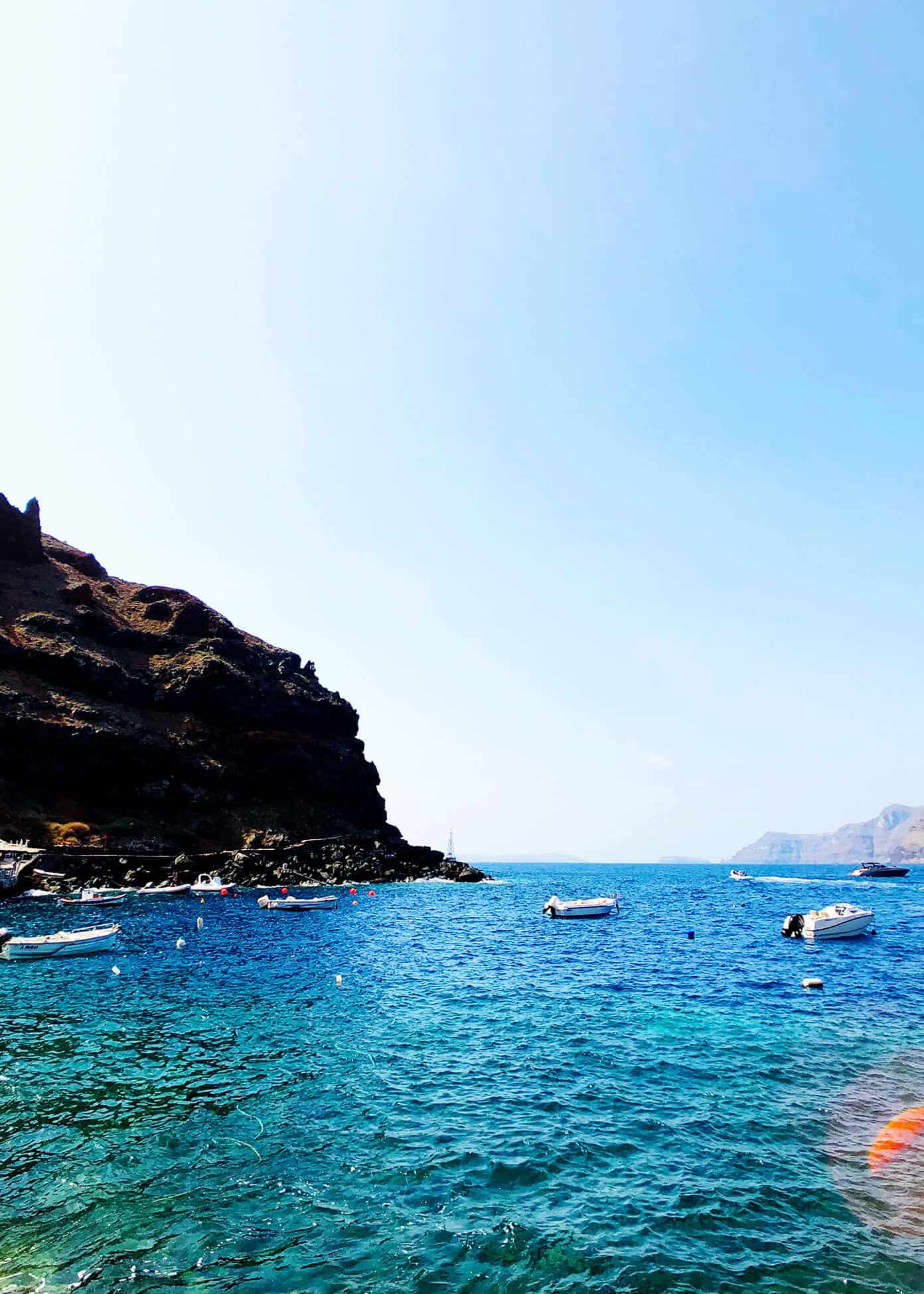 The Gimme Some Oven travel guide for restaurants to eat, hotels to stay and places to visit in Santorini, Greece. | Gimme Some Oven #santorini #greece #travel #traveltips #europe #vacation #islands #hotel #restaurant Ammoudi Bay Ocean Views in Oia Santorini Greece