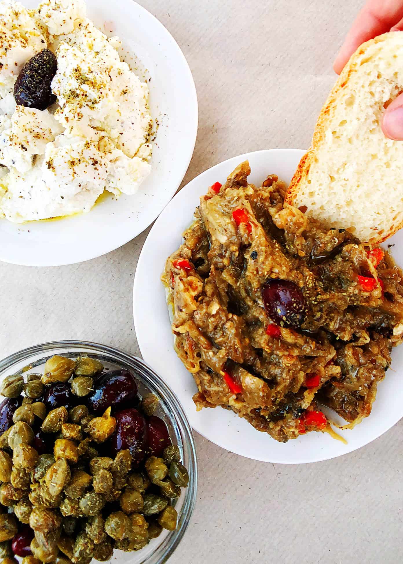 The Gimme Some Oven travel guide for restaurants to eat, hotels to stay and places to visit in Santorini, Greece. | Gimme Some Oven #santorini #greece #travel #traveltips #europe #vacation #islands #hotel #restaurant Greek Appetizer Dips with Bread in Folegandros, Greece