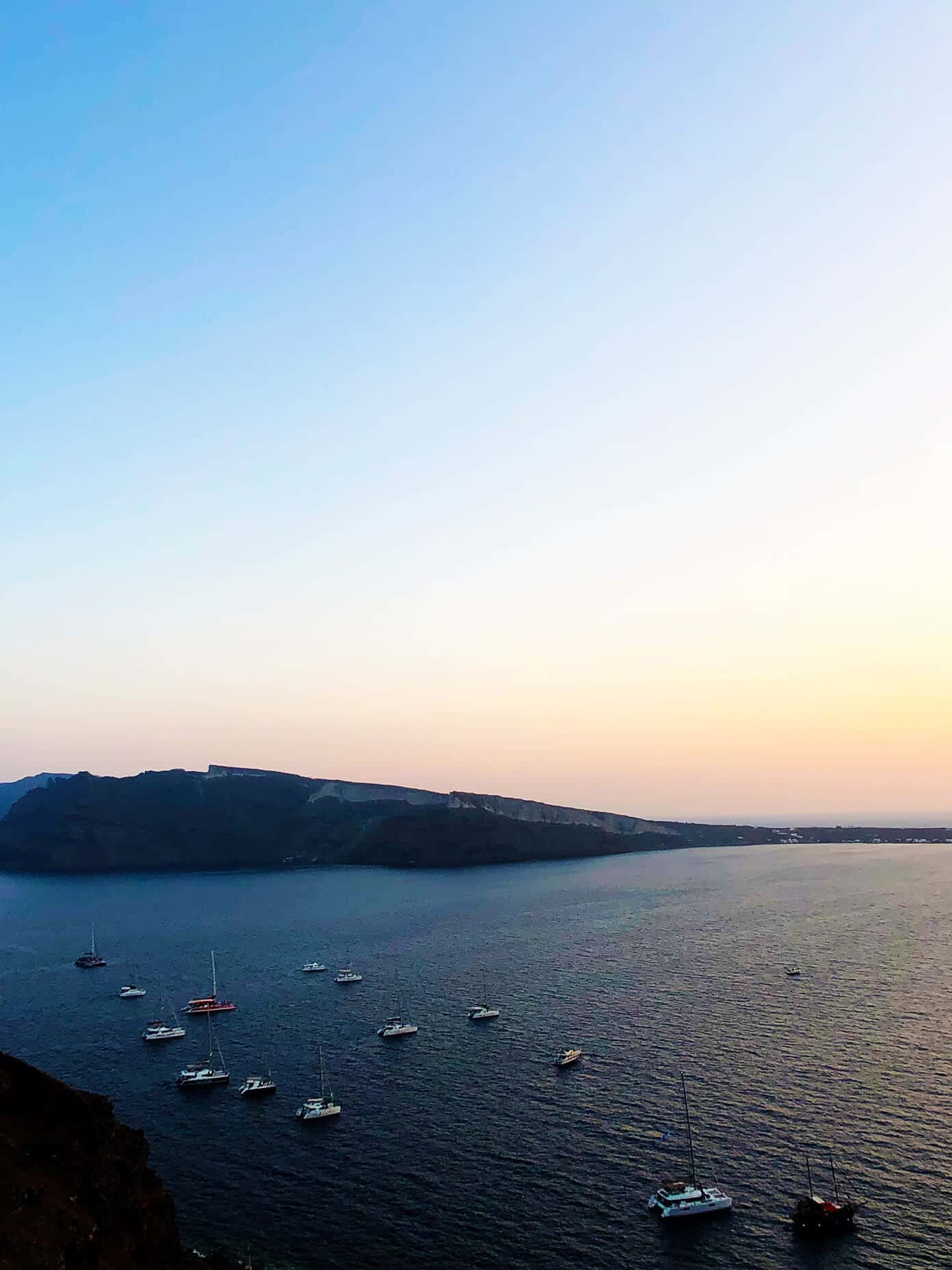 The Gimme Some Oven travel guide for restaurants to eat, hotels to stay and places to visit in Santorini, Greece. | Gimme Some Oven #santorini #greece #travel #traveltips #europe #vacation #islands #hotel #restaurant Ammoudi Bay in Oia Santorini Greece