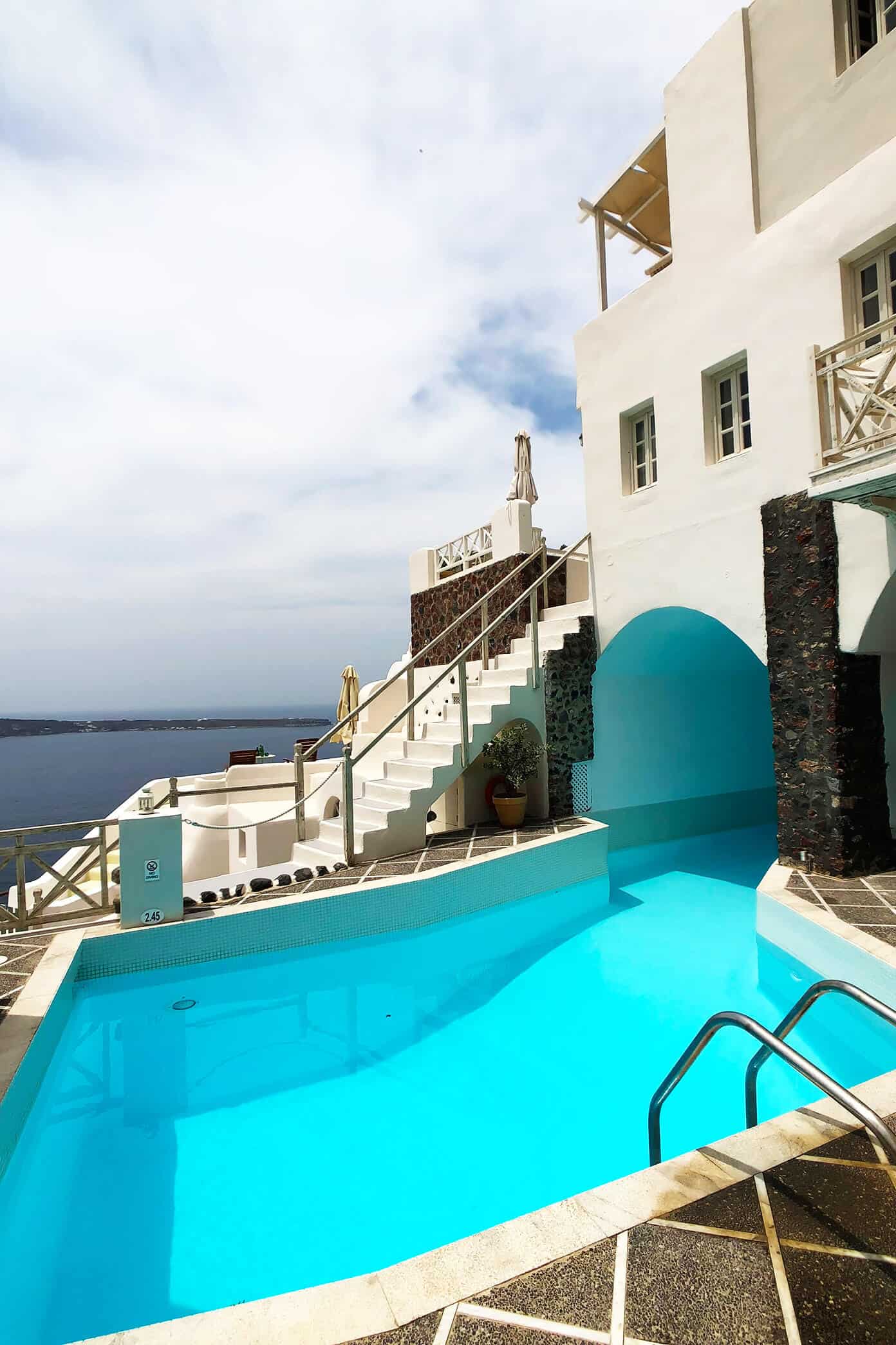 The Gimme Some Oven travel guide for restaurants to eat, hotels to stay and places to visit in Santorini, Greece. | Gimme Some Oven #santorini #greece #travel #traveltips #europe #vacation #islands #hotel #restaurant Swimming Pool at Oia Mare Villas Santorini Greece