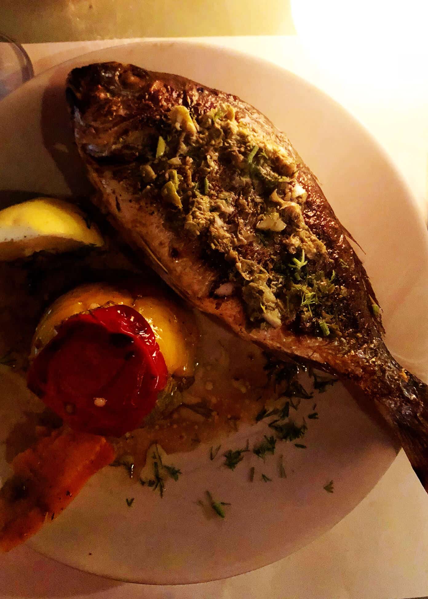The Gimme Some Oven travel guide for restaurants to eat, hotels to stay and places to visit in Santorini, Greece. | Gimme Some Oven #santorini #greece #travel #traveltips #europe #vacation #islands #hotel #restaurant Fish at Karma Restaurant in Oia Santorini Greece