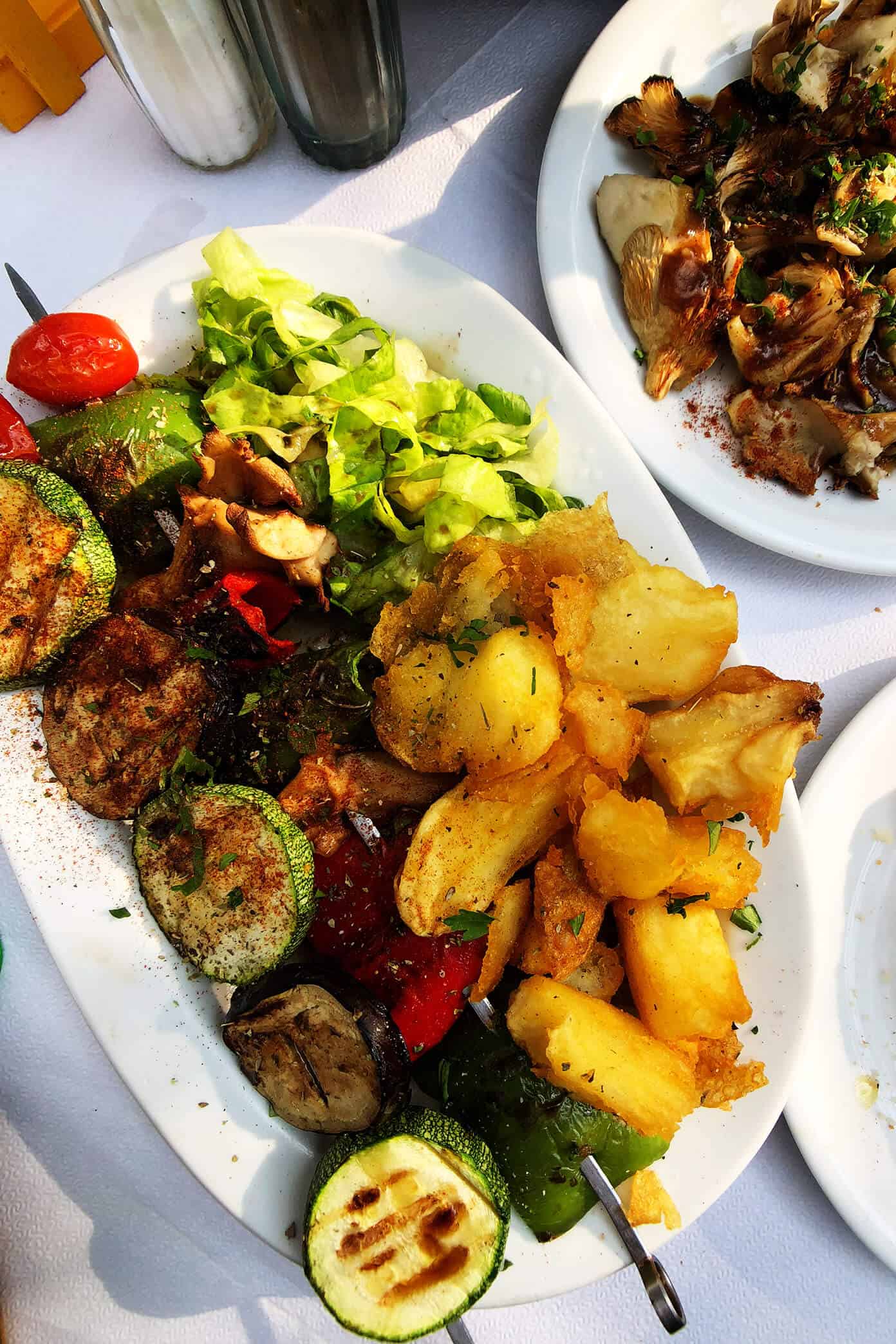 The Gimme Some Oven travel guide for restaurants to eat, hotels to stay and places to visit in Santorini, Greece. | Gimme Some Oven #santorini #greece #travel #traveltips #europe #vacation #islands #hotel #restaurant Vegan Souvlaki Vegetables at Melissa in Folegandros, Greece