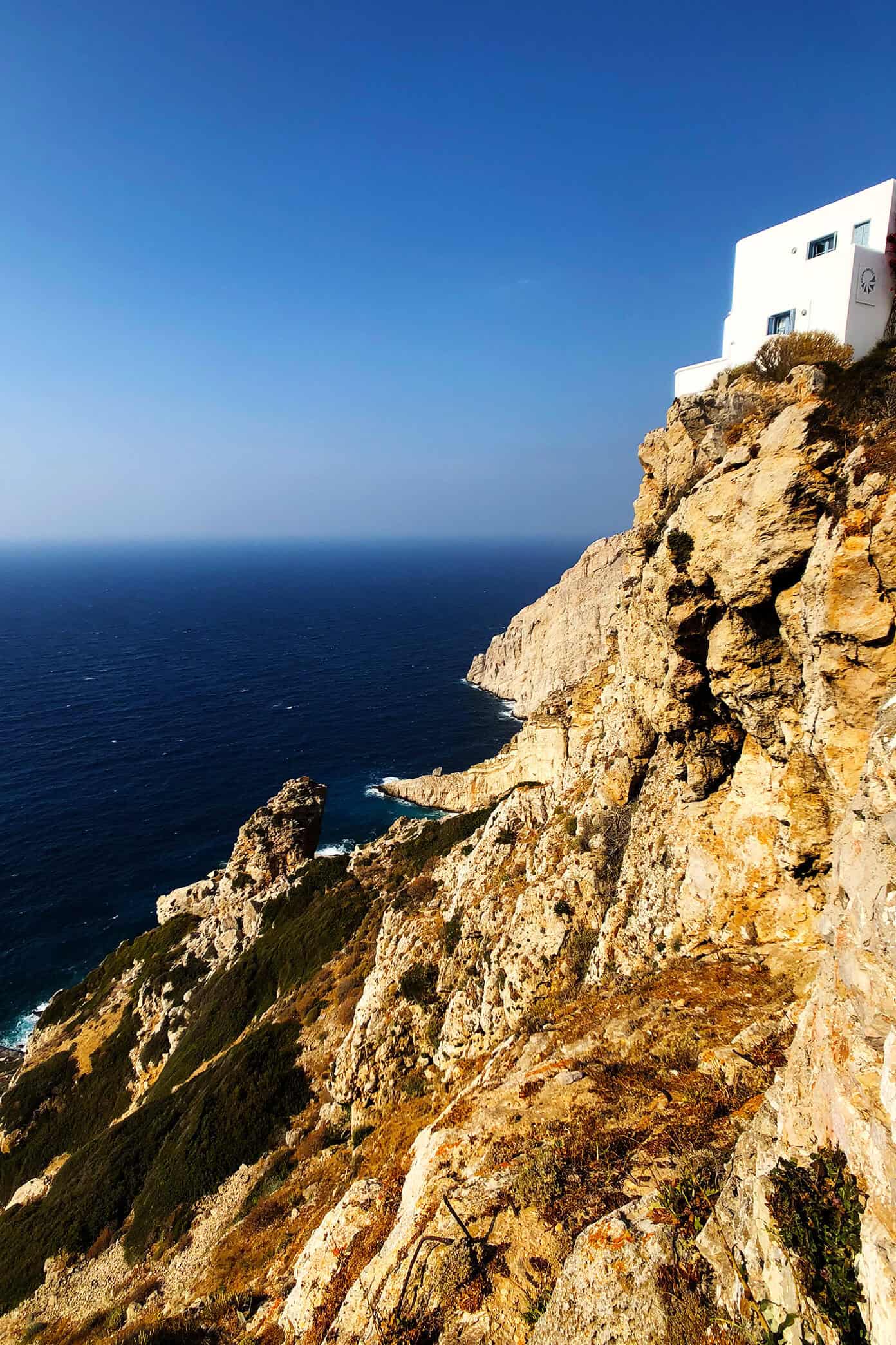 The Gimme Some Oven travel guide for restaurants to eat, hotels to stay and places to visit in Santorini, Greece. | Gimme Some Oven #santorini #greece #travel #traveltips #europe #vacation #islands #hotel #restaurant Cliffs in Folegandros, Greece