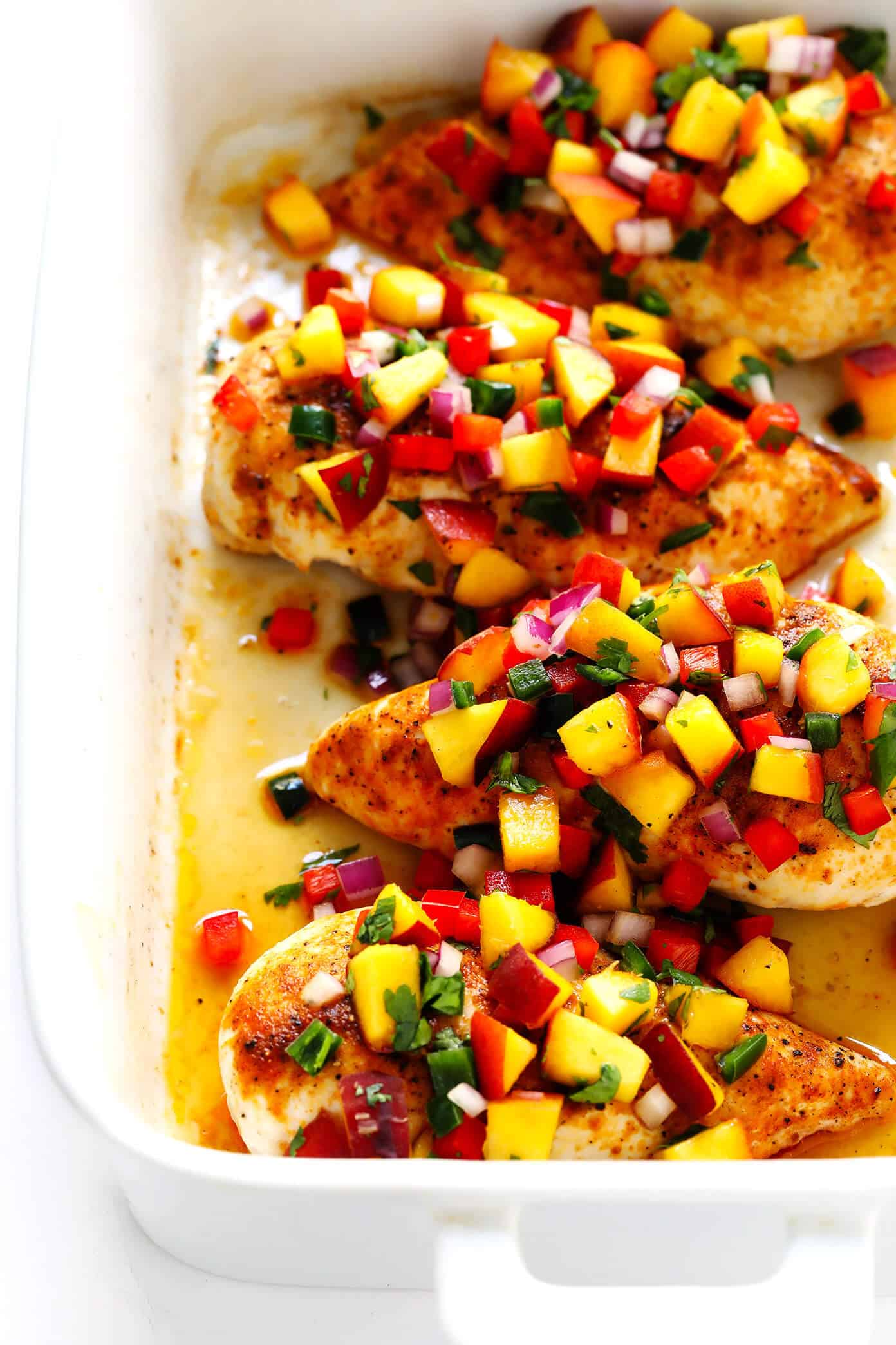 This Baked Ginger Chicken recipe is perfectly cooked and full of great flavor, then topped with a sprinkling of confetti fresh peach salsa. It's the perfect sweet and savory summer dinner recipe! | Gimme Some Oven Ginger Baked Chicken Breasts with Fruit Salsa