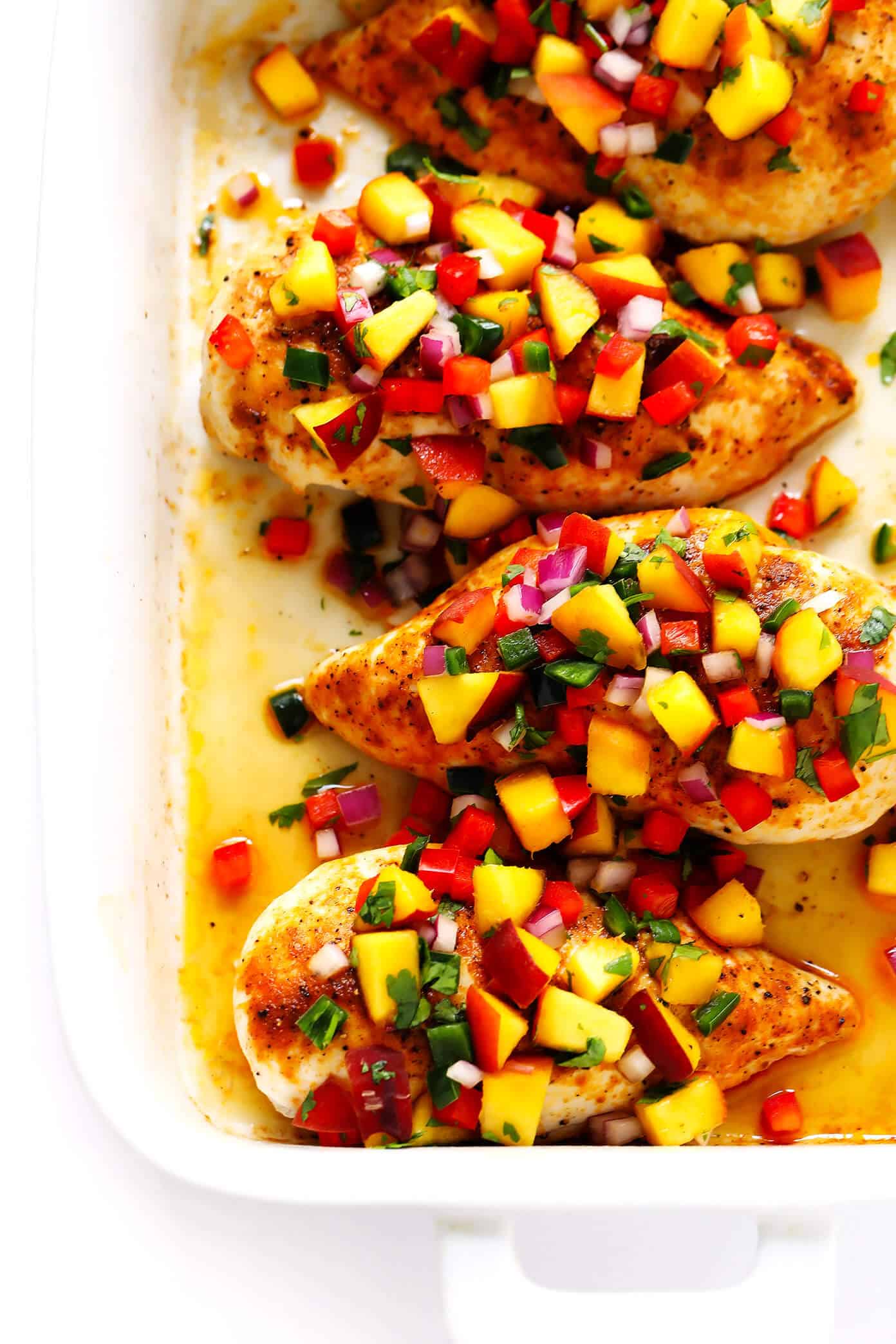 This Baked Ginger Chicken recipe is perfectly cooked and full of great flavor, then topped with a sprinkling of confetti fresh peach salsa. It's the perfect sweet and savory summer dinner recipe! | Gimme Some Oven Ginger Baked Chicken with Peach Salsa Recipe