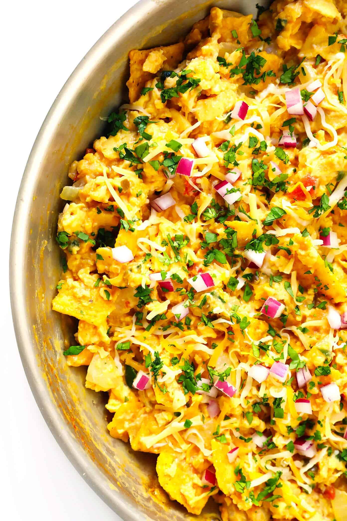 LOVE this easy migas recipe! It's a simple Tex-Mex egg scramble made with leftover tortilla chips and salsa, and sprinkled with avocado, cheese and any other favorite toppings. Wrap in tortillas to make tacos, or just serve plain for breakfast, brunch, lunch or dinner! | Gimme Some Oven #migas #texmex #breakfast #brunch #egg #scramble #mexican #vegetarian #dinner How To Make Migas for Tacos