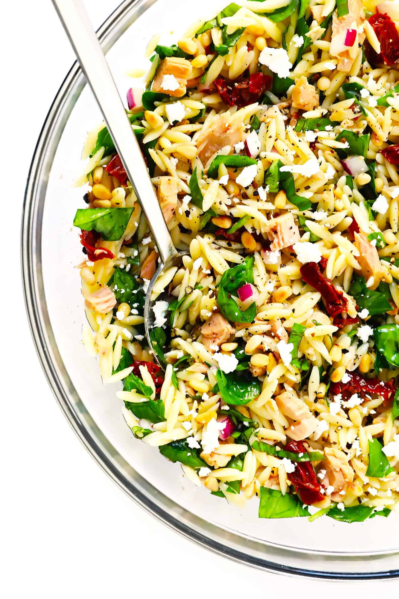 LOVE this Italian Orzo Tuna Salad -- made with chilled pasta, sun-dried tomatoes, pine nuts, feta cheese, basil, and a delicious lemon dressing. It's the perfect make ahead recipe for easy lunch or dinner or potlucks! | Gimme Some Oven Italian Orzo Tuna Salad with Sun-Dried Tomatoes, Spinach and Feta