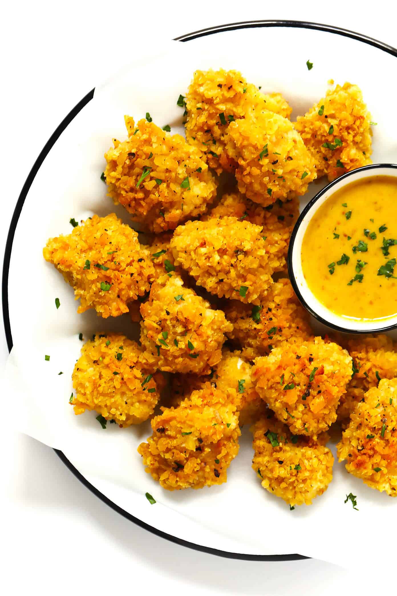 These Ultra-Crispy Baked Chicken nuggets are the best! They're made with 3 ingredients, naturally gluten-free, and easy to customize with your favorite flavors. The perfect easy dinner recipe! | Gimme Some Oven #dinner #chicken #nuggets #kids #glutenfree #kettlechips 3-Ingredient Ultra Crispy Baked Chicken Nuggets with Honey Mustard Sauce