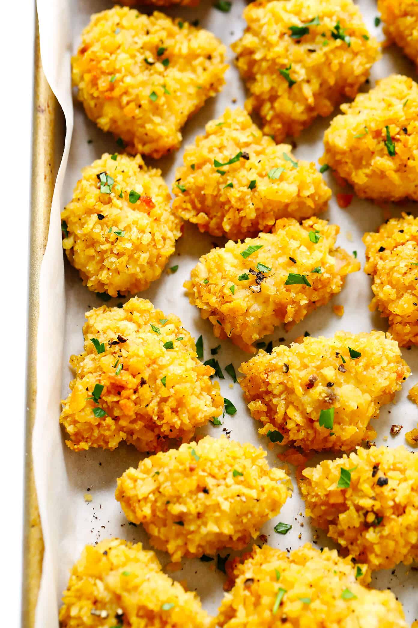 These Ultra-Crispy Baked Chicken nuggets are the best! They're made with 3 ingredients, naturally gluten-free, and easy to customize with your favorite flavors. The perfect easy dinner recipe! | Gimme Some Oven #dinner #chicken #nuggets #kids #glutenfree #kettlechips 3-Ingredient Baked Chicken Nuggets Recipe with Kettle Chips
