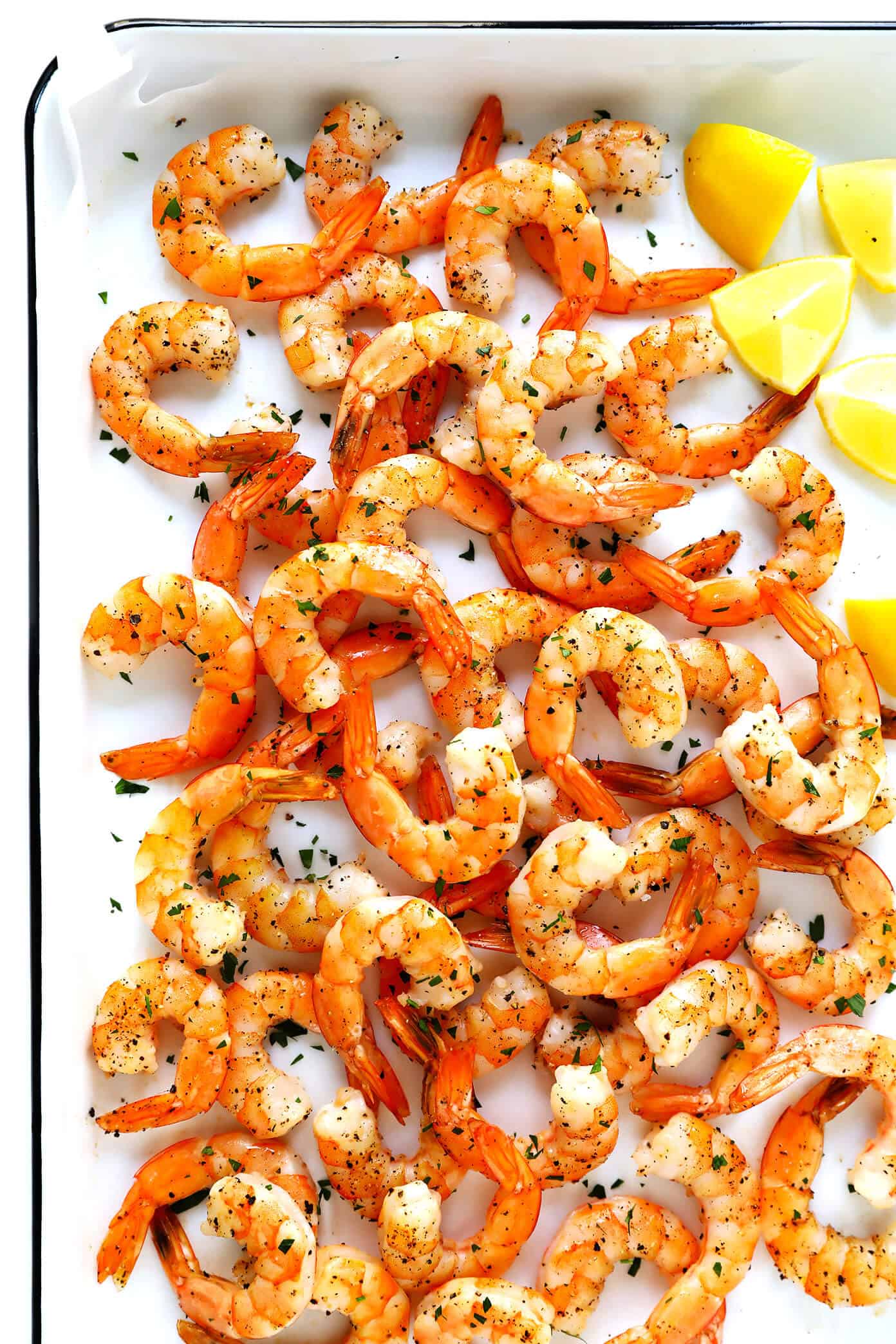 This 10-Minute Baked Shrimp recipe is brilliant! It's super easy to cook in the oven, totally customizable with your favorite seasonings, and absolutely delicious. | Gimme Some Oven #shrimp #oven #healthy #dinner #recipe #easy #glutenfree Oven Roasted Shrimp with Lemon