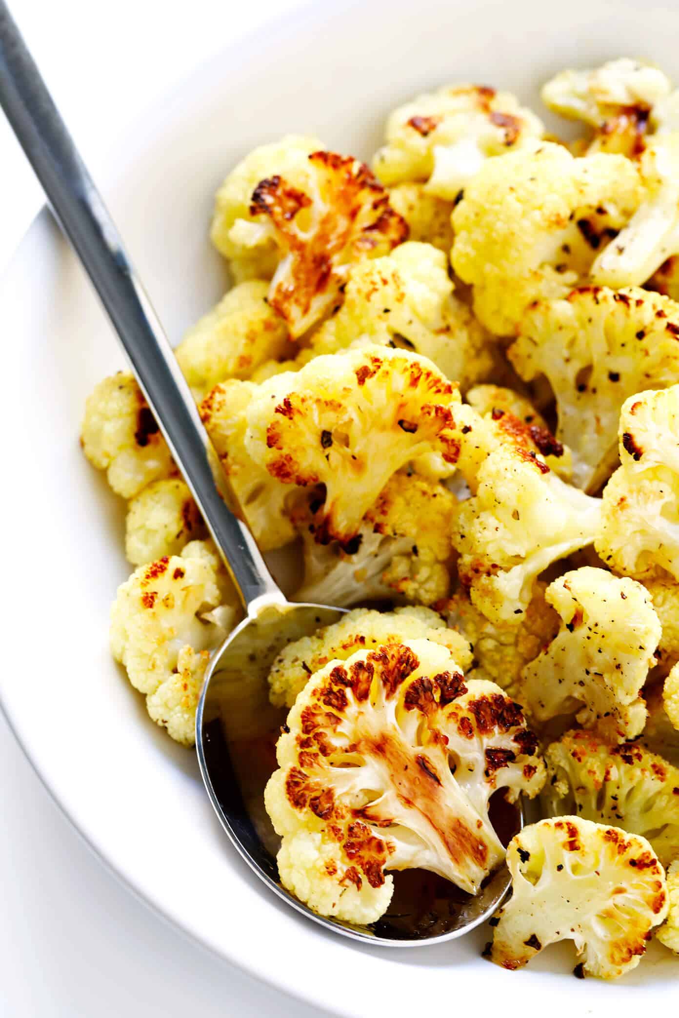 The BEST Roasted Cauliflower recipe -- super easy to make in the oven, naturally #glutenfree and #vegan, and easy to customize with any of your favorite seasonings. It's the perfect healthy side dish. Or perfect for adding to a salad, soup, pizza, dip, pasta, tacos or more! | Gimme Some Oven How To Make Roasted Cauliflower