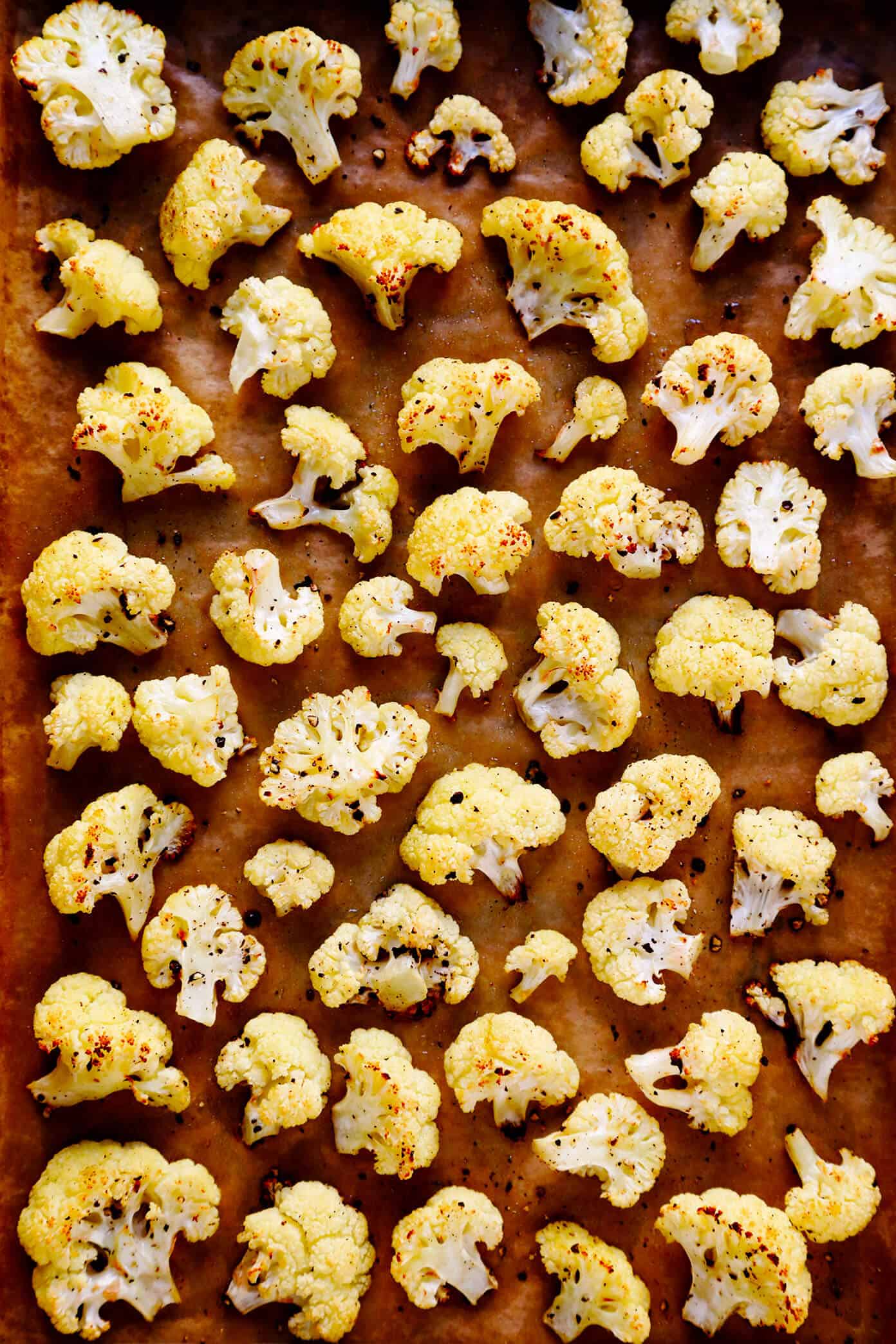 The BEST Roasted Cauliflower recipe -- super easy to make in the oven, naturally #glutenfree and #vegan, and easy to customize with any of your favorite seasonings. It's the perfect healthy side dish. Or perfect for adding to a salad, soup, pizza, dip, pasta, tacos or more! | Gimme Some Oven The BEST Roasted Cauliflower Recipe