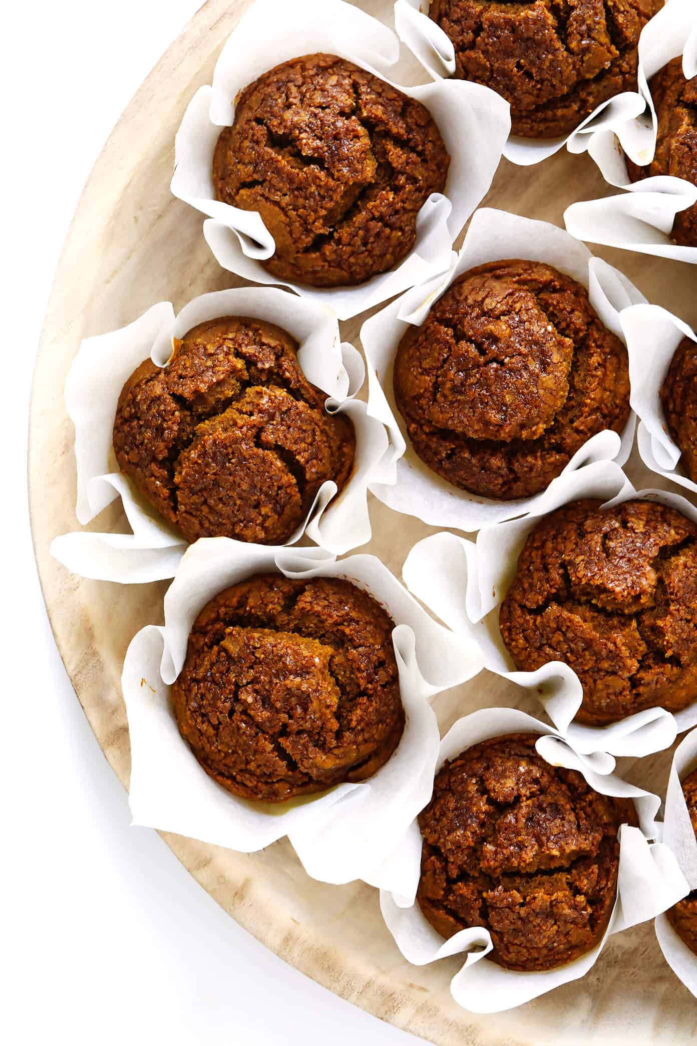 LOVE this healthy pumpkin muffins recipe! They're naturally gluten-free, naturally sweetened with maple syrup, easy to make, and SO delicious. Perfect for fall breakfast, dessert, and snacking. | Gimme Some Oven #pumpkin #muffins #breakfast #glutenfree #healthy #fall #thanksgiving #dessert Healthy Pumpkin Muffins with Parchment Liners