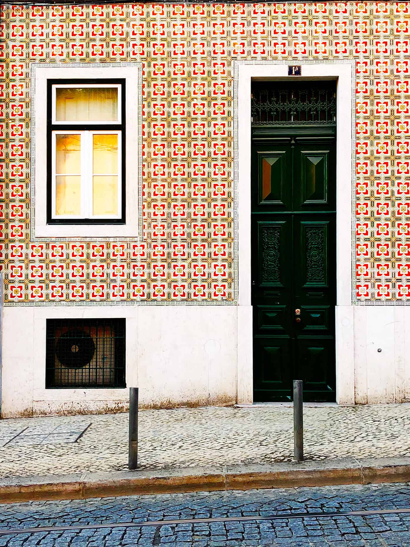 Weekend in Lisbon, Portugal -- all of our best recs on where to stay, eat and visit! | gimmesomeoven.com #travel #lisbon #portugal #traveltips Red tile house in Lisbon