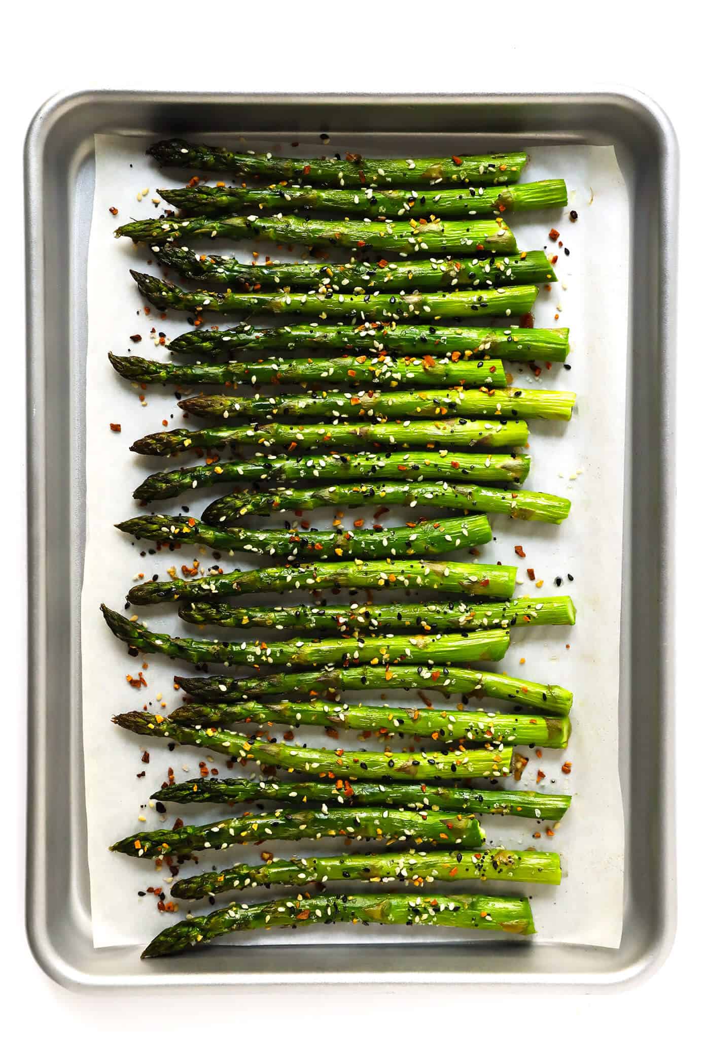 Kick your roasted asparagus recipe up a notch this season with some everything bagel seasoning! It's super quick and easy to make, naturally vegan and gluten-free, and makes the most delicious healthy side dish. | Gimme Some Oven #asparagus #side #vegetable #healthy #dinner #thanksgiving #christmas #holiday #fall #winter "Everything" Roasted Asparagus | Gimme Some Oven