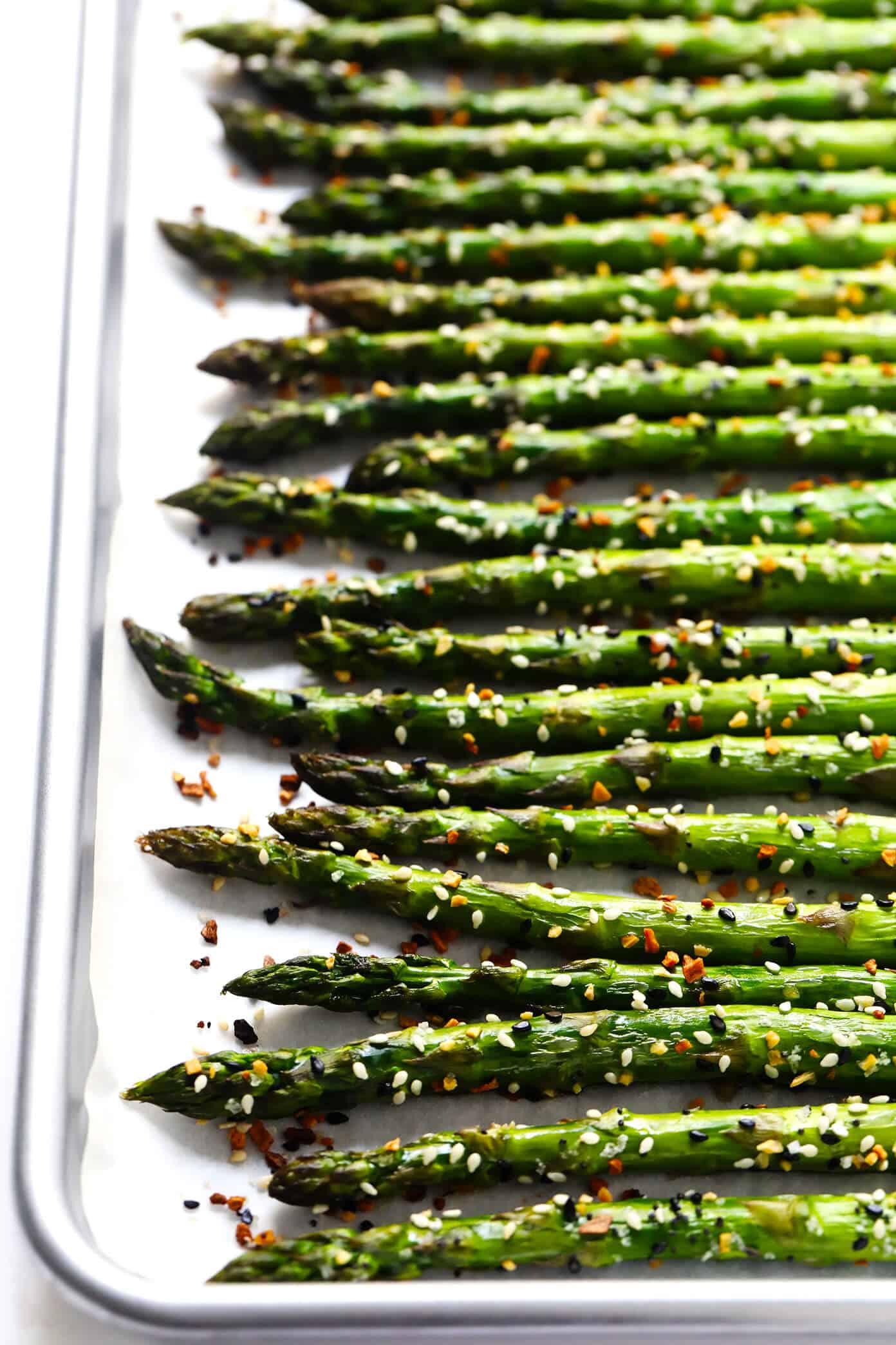 Kick your roasted asparagus recipe up a notch this season with some everything bagel seasoning! It's super quick and easy to make, naturally vegan and gluten-free, and makes the most delicious healthy side dish. | Gimme Some Oven #asparagus #side #vegetable #healthy #dinner #thanksgiving #christmas #holiday #fall #winter "Everything" Roasted Asparagus