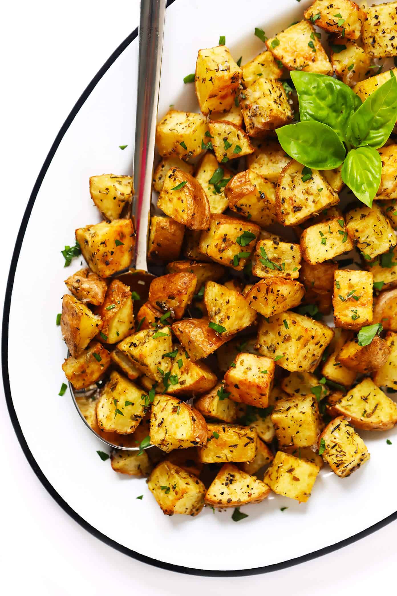 My favorite recipe for ultra crispy roasted potatoes -- made with 3 different seasonings (smoky, lemony, cheesy), naturally gluten-free, and SO delicious. They are perfect served as breakfast potatoes, or as a simple side dish for dinner or snacking. | Gimme Some Oven #roasted #potatoes #crispy #breakfast #side #gameday #snack #glutenfree #vegetarian #vegan Garlic Crispy Roasted Potatoes Recipe