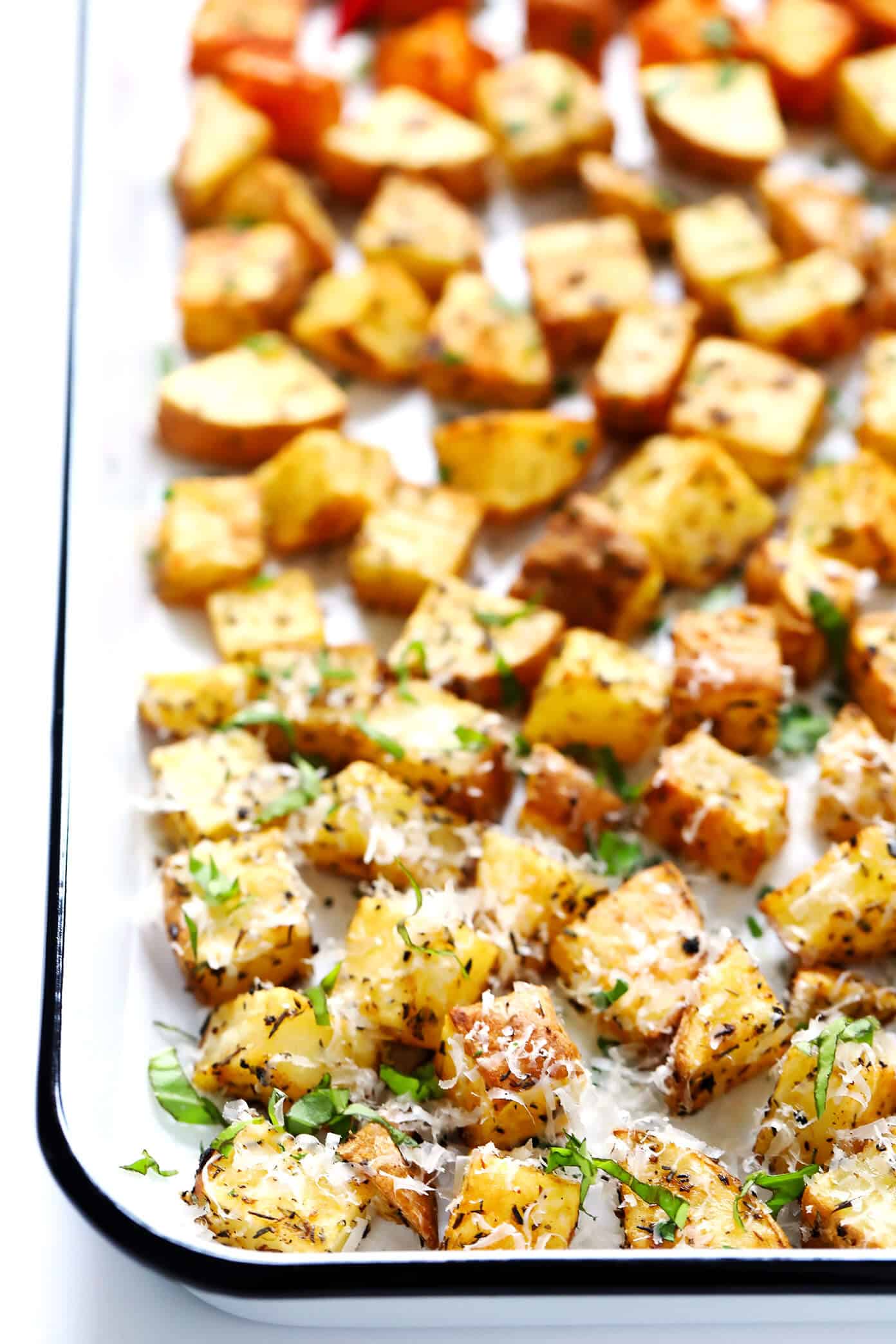 My favorite recipe for ultra crispy roasted potatoes -- made with 3 different seasonings (smoky, lemony, cheesy), naturally gluten-free, and SO delicious. They are perfect served as breakfast potatoes, or as a simple side dish for dinner or snacking. | Gimme Some Oven #roasted #potatoes #crispy #breakfast #side #gameday #snack #glutenfree #vegetarian #vegan Crispy Roasted Potatoes Recipe | Smoky, Lemony and Cheesy