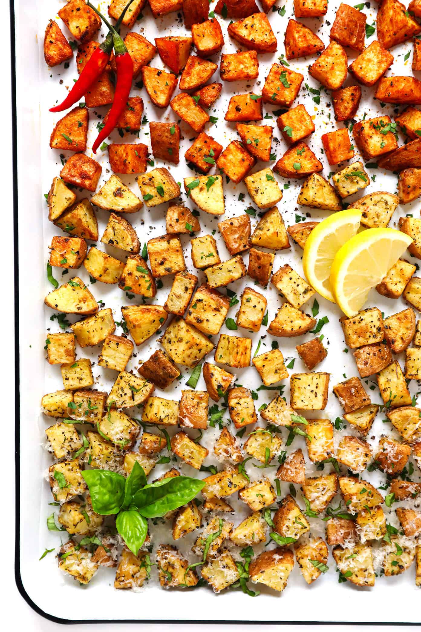 My favorite recipe for ultra crispy roasted potatoes -- made with 3 different seasonings (smoky, lemony, cheesy), naturally gluten-free, and SO delicious. They are perfect served as breakfast potatoes, or as a simple side dish for dinner or snacking. | Gimme Some Oven #roasted #potatoes #crispy #breakfast #side #gameday #snack #glutenfree #vegetarian #vegan Extra Crispy Roasted Potatoes -- 3 Ways!