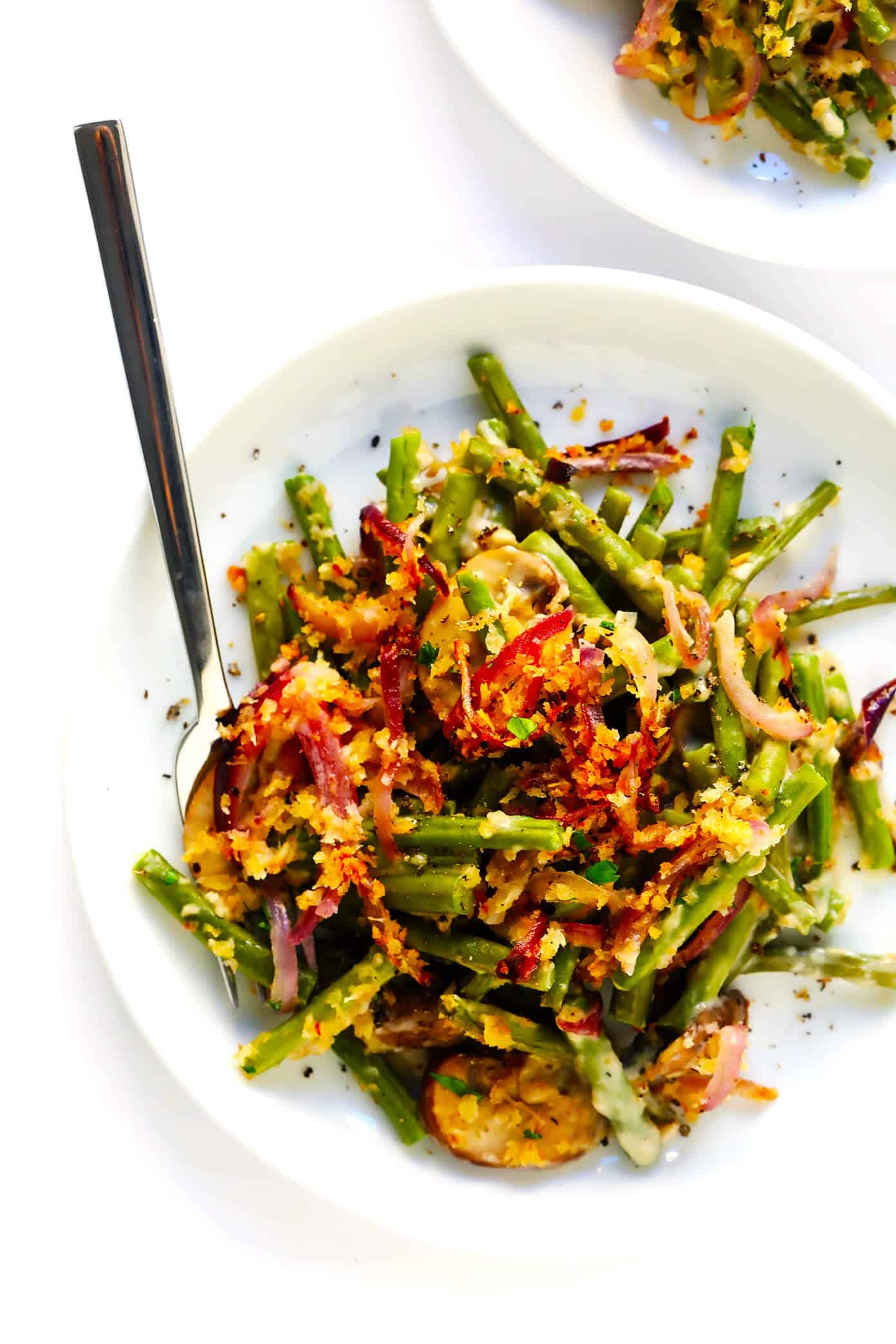 This BEST green bean casserole recipe -- made 100% from scratch with a crispy onion topping and creamy Parmesan mushroom green bean filling. So fresh and flavorful, and always the perfect side dish for Thanksgiving! | gimmesomeoven.com Best Green Bean Casserole on Serving Plate