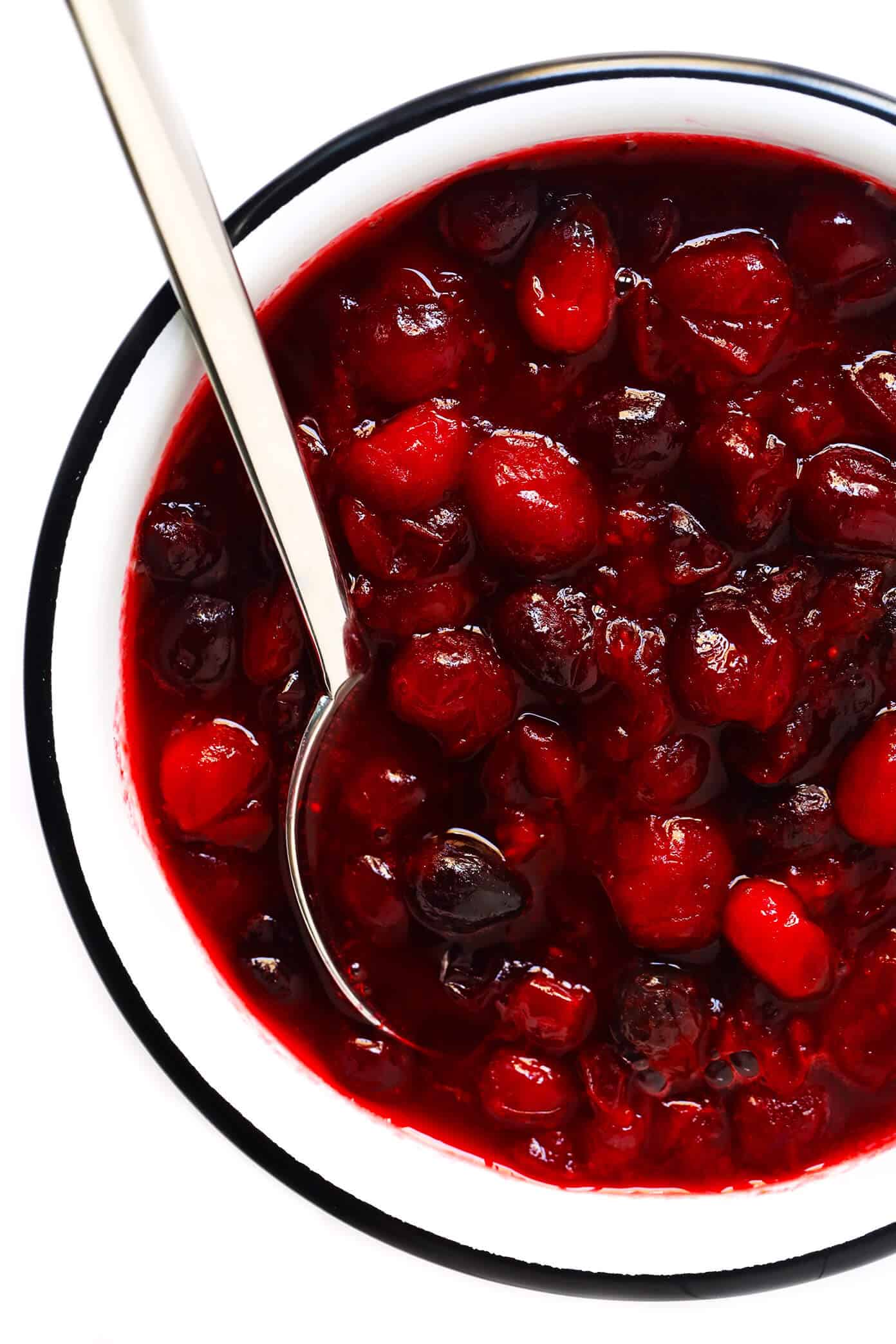 This homemade Maple Cranberry Sauce recipe is naturally-sweetened with real maple syrup, it's easy to make in about 15 minutes, and it's totally delicious. Perfect for Thanksgiving, Christmas, or anytime you'd love an extra pop of color on the dinner table. | Gimme Some Oven #cranberry #sauce #thanksgiving #naturallysweetened #sugarfree #maple #vegan #glutenfree #vegetarian #side #christmas #holiday #dinner Maple Cranberry Sauce Recipe