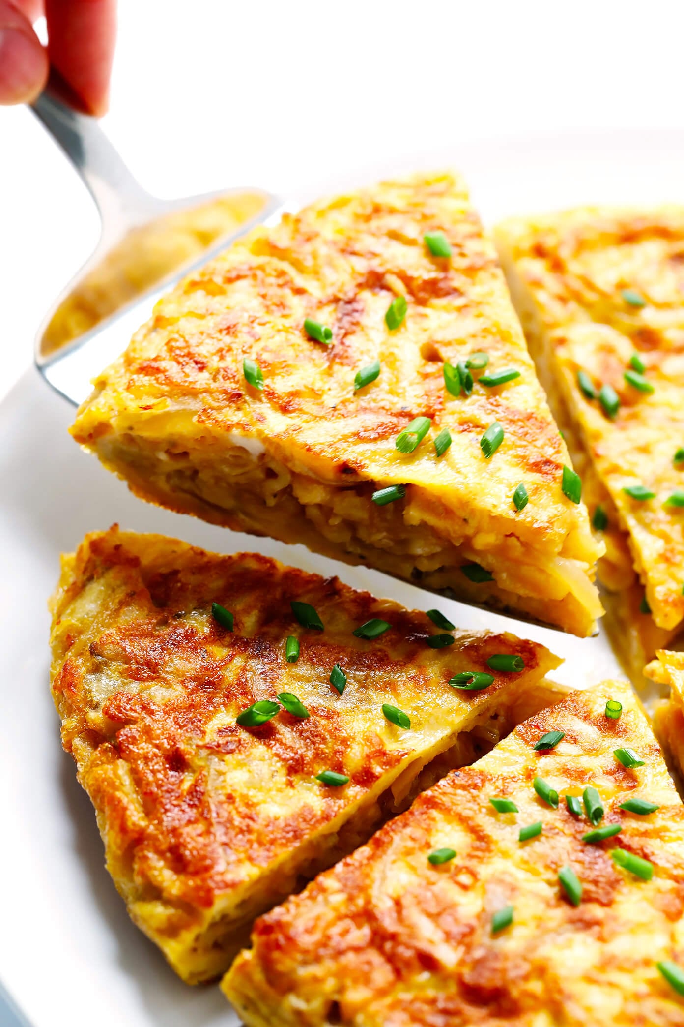 This 15-Minute Shortcut Spanish Omelette (Tortilla Española) is super quick and easy to make, thanks to a secret ingredient -- KETTLE CHIPS! All you need are four easy ingredients to make this delicious egg and potato omelette. | Gimme Some Oven #omelette #spanish #egg #potato #spain #tortilla Shortcut Spanish Tortilla