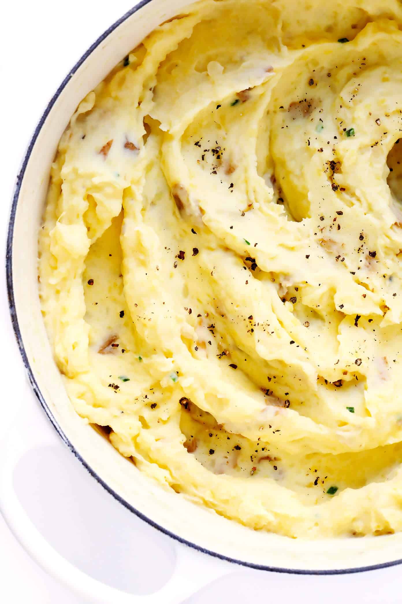 My all-time favorite mashed potatoes recipe! These homemade mashed potatoes are perfectly rich and creamy and buttery, full of great flavor, easy to make, and always a crowd fave. Perfect for Thanksgiving or other holidays, or just as a delicious side dish for any weeknight dinner. Feel free to add extra garlic or seasonings if you would like. | Gimme Some Oven #mashed #potatoes #thanksgiving #christmas #side #glutenfree #creamy #garlic #sidedish #recipe #vegetarian The BEST Mashed Potatoes Recipe