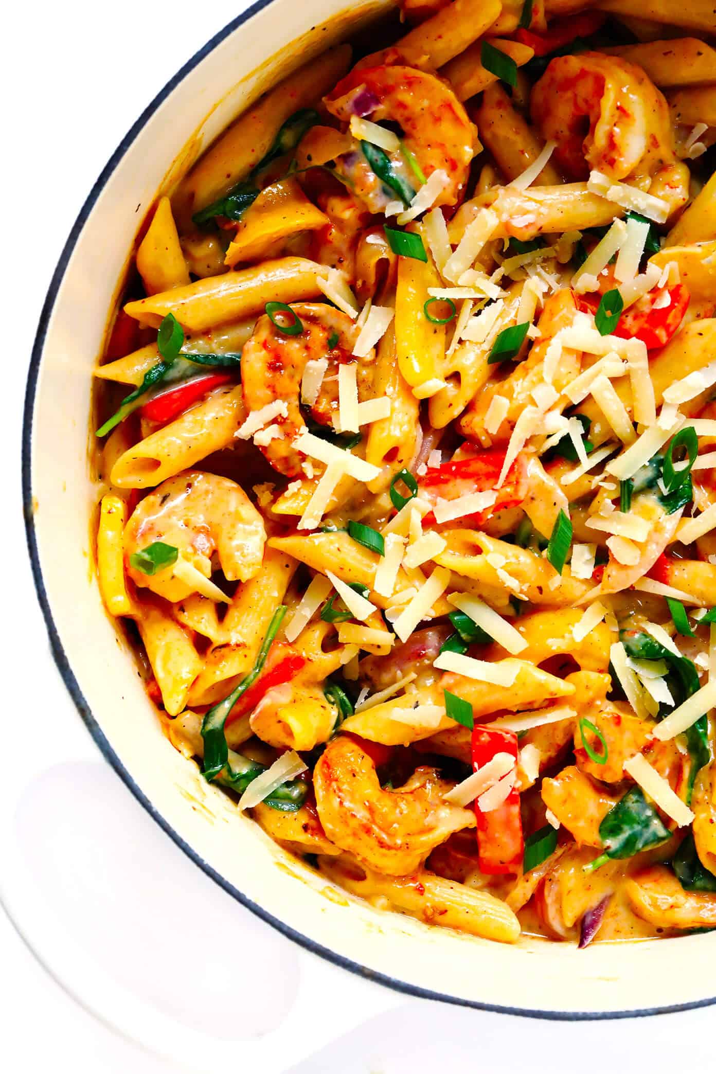 This Cajun Shrimp Pasta recipe is made with the most delicious creamy alfredo sauce, colorful veggies, and zesty shrimp (or chicken, sausage, or your preferred protein). It's comfort food with a kick! | gimmesomeoven.com #pasta #cajun #shrimp #dinner #recipe #alfredo #sauce Cajun Shrimp Pasta