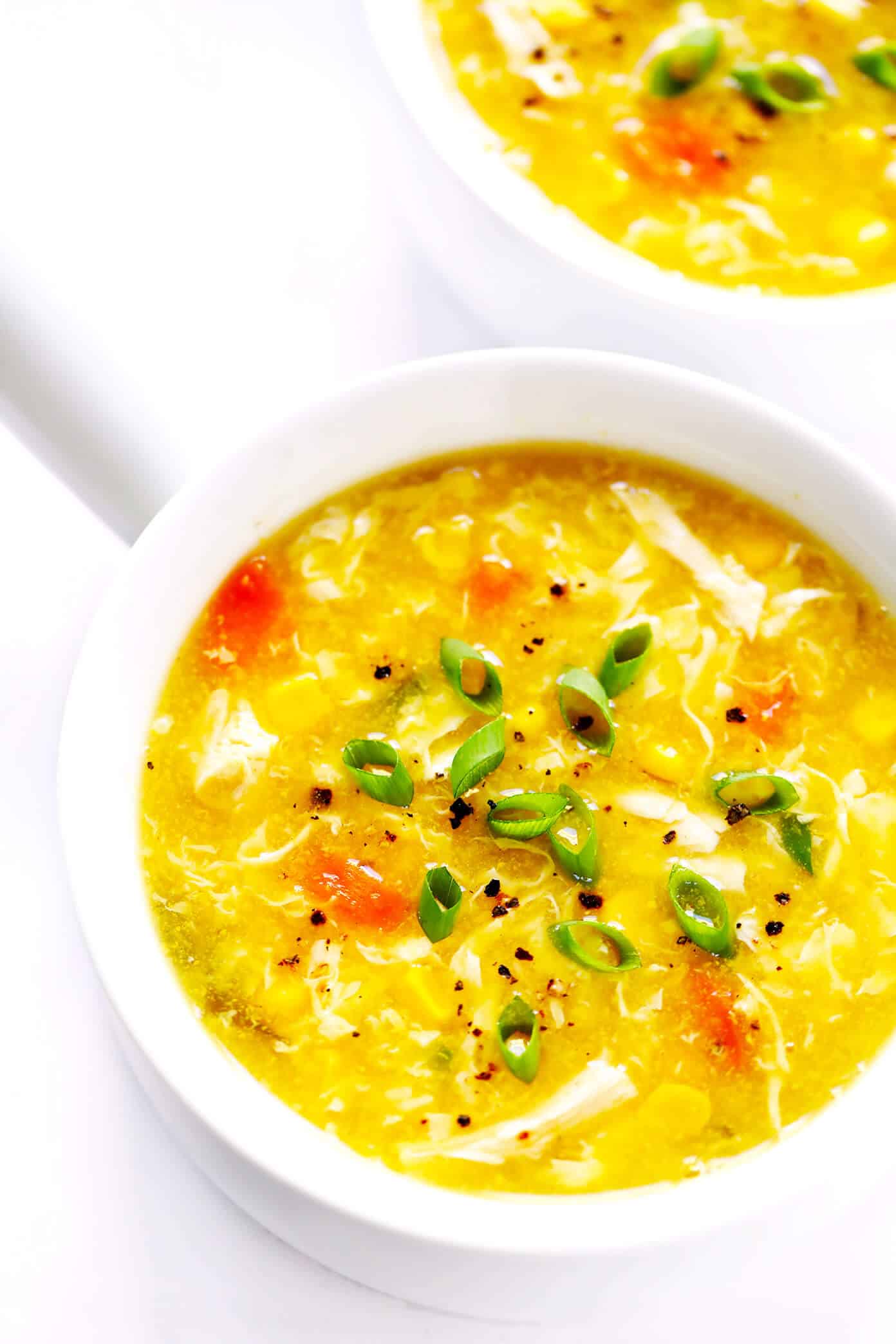 LOVE this cozy Chicken and Sweet Corn Soup recipe. It's basically an egg drop soup that's loaded up with chicken, corn and veggies. It's easy to make on the stovetop or in the Instant Pot. And it's sooo comforting and delicious. | Gimme Some Oven #eggdropsoup #chicken #soup #dinner #instantpot #healthy #glutenfree Chicken and Sweet Corn Soup with Green Onions