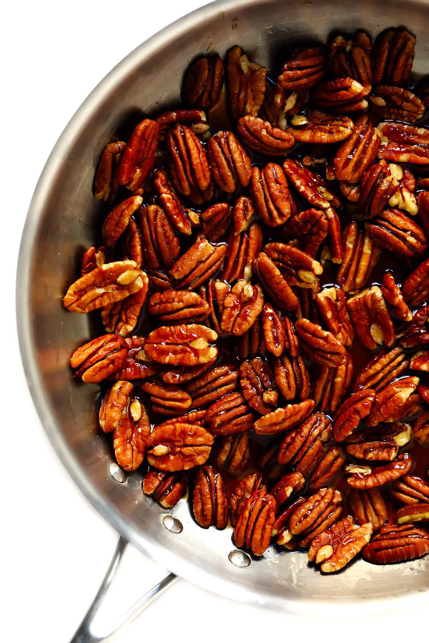 This 5-Ingredient Maple Candied Pecans recipe is irresistibly delicious! It's naturally sweetened with maple syrup, easy to make on the stovetop, and perfect for snacking, sprinkling on salads, or giving away as homemade gifts. | Gimme Some Oven #candied #pecans #glutenfree #vegan #maple #dessert #homemade #gift How To Make Candied Pecans